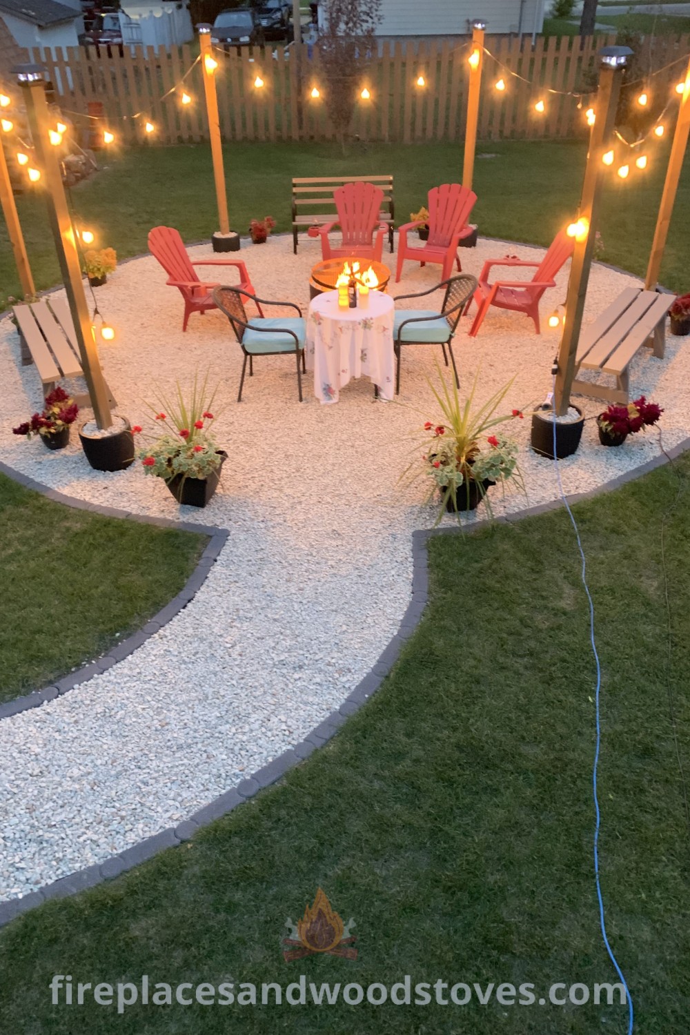 An outdoor dining area with chairs, string lights, and a gravel path leading to the backyard, showcasing stylish landscaping ideas for the front of the house and simple yard landscape improvements. Discover more incredible outdoor ideas at patioandhomefurniture.com.