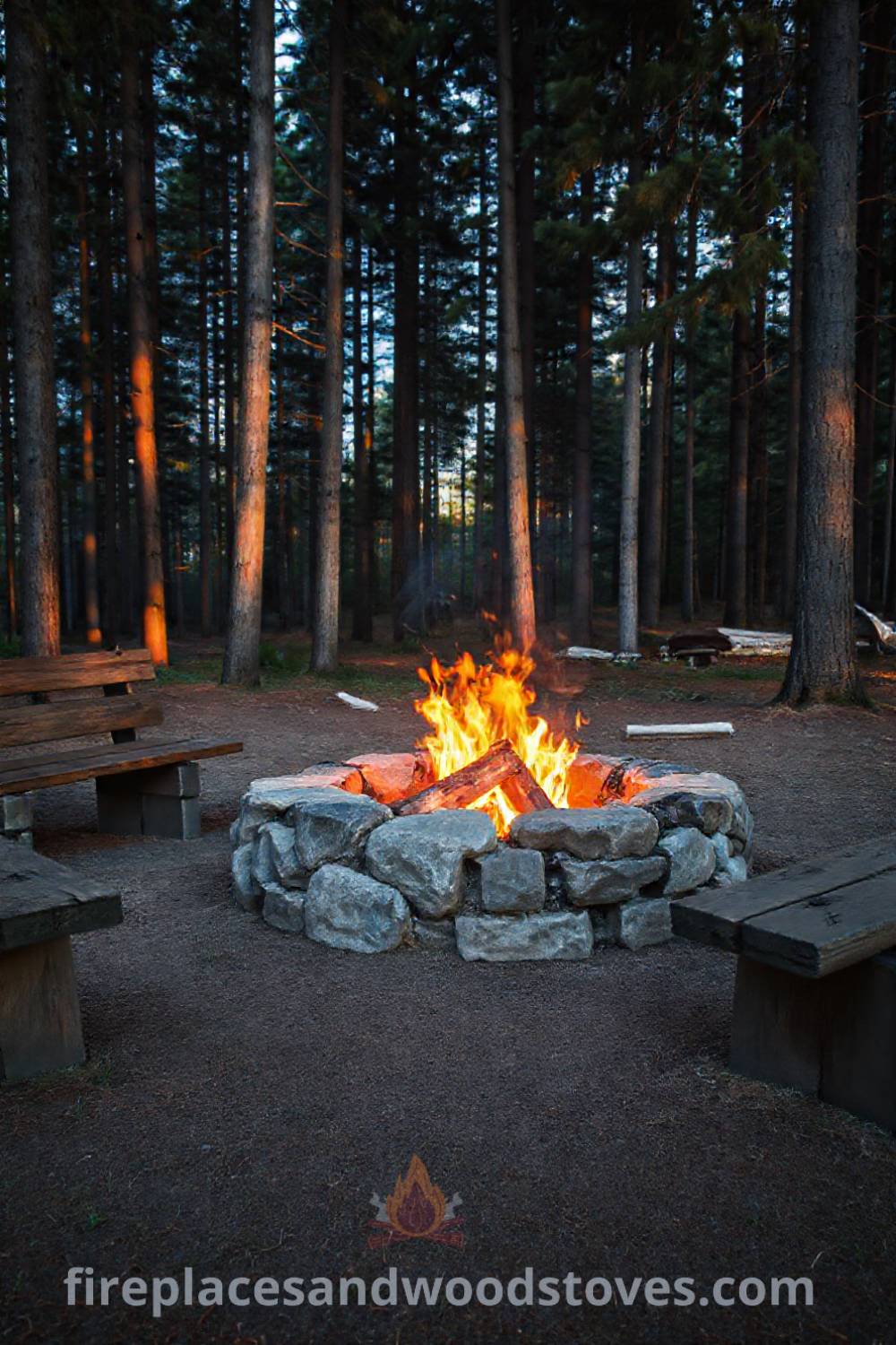 Stone fire pit at a wooded campsite surrounded by tall pines, featuring log benches and flickering flames, creating a cozy atmosphere ideal for gatherings. Visit patioandhomefurniture.com for stylish outdoor design inspiration.