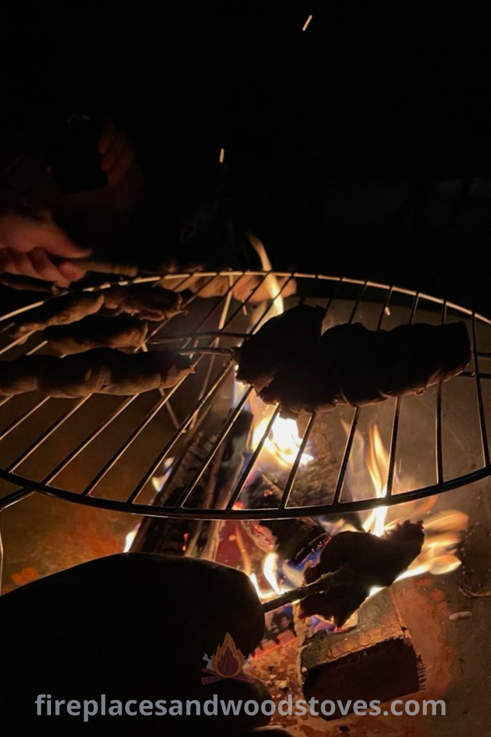 Open grill cooking in the dark, flames providing a warm glow, showcasing a perfect barbecue aesthetic night. Ideal for gathering with friends, this cozy scene transforms your backyard into a stylish cookout space. Discover more incredible ideas at patioandhomefurniture.com.