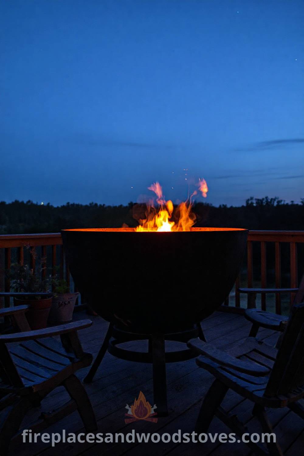 Metal fire pit on a wooden deck surrounded by mismatched chairs and potted plants, silhouetted against a twilight sky, creating a cozy atmosphere for outdoor gatherings. Visit patioandhomefurniture.com for stylish ideas that will wow your guests.