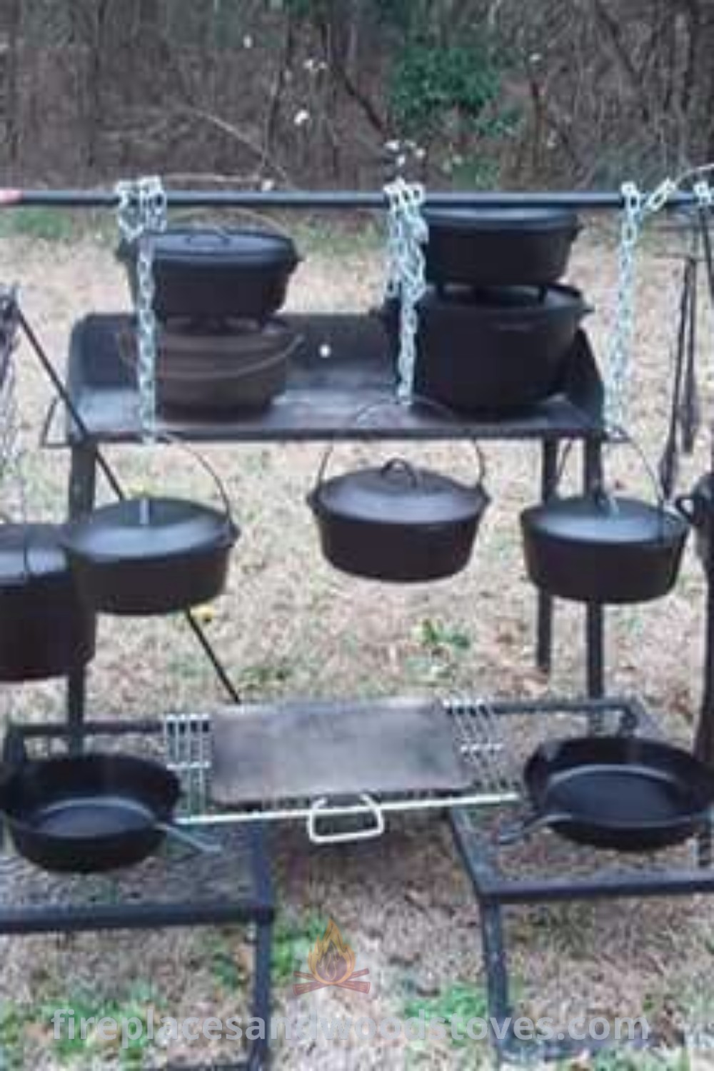 An outdoor cooking station featuring pots and pans, ideal for campfire cooking and primitive camping. Discover inspiring camp kitchen ideas that transform your campsite into a stylish and functional cooking area. Explore more at patioandhomefurniture.com.