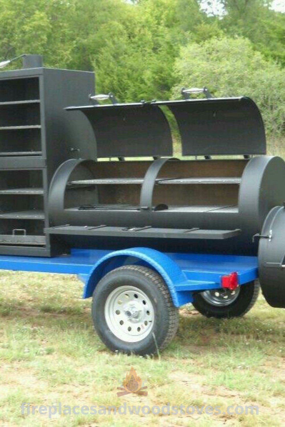 A blue trailer grill featuring an open grill and shelves attached to its sides, ideal for outdoor cooking and entertaining. Discover stylish designs and custom BBQ options at patioandhomefurniture.com.