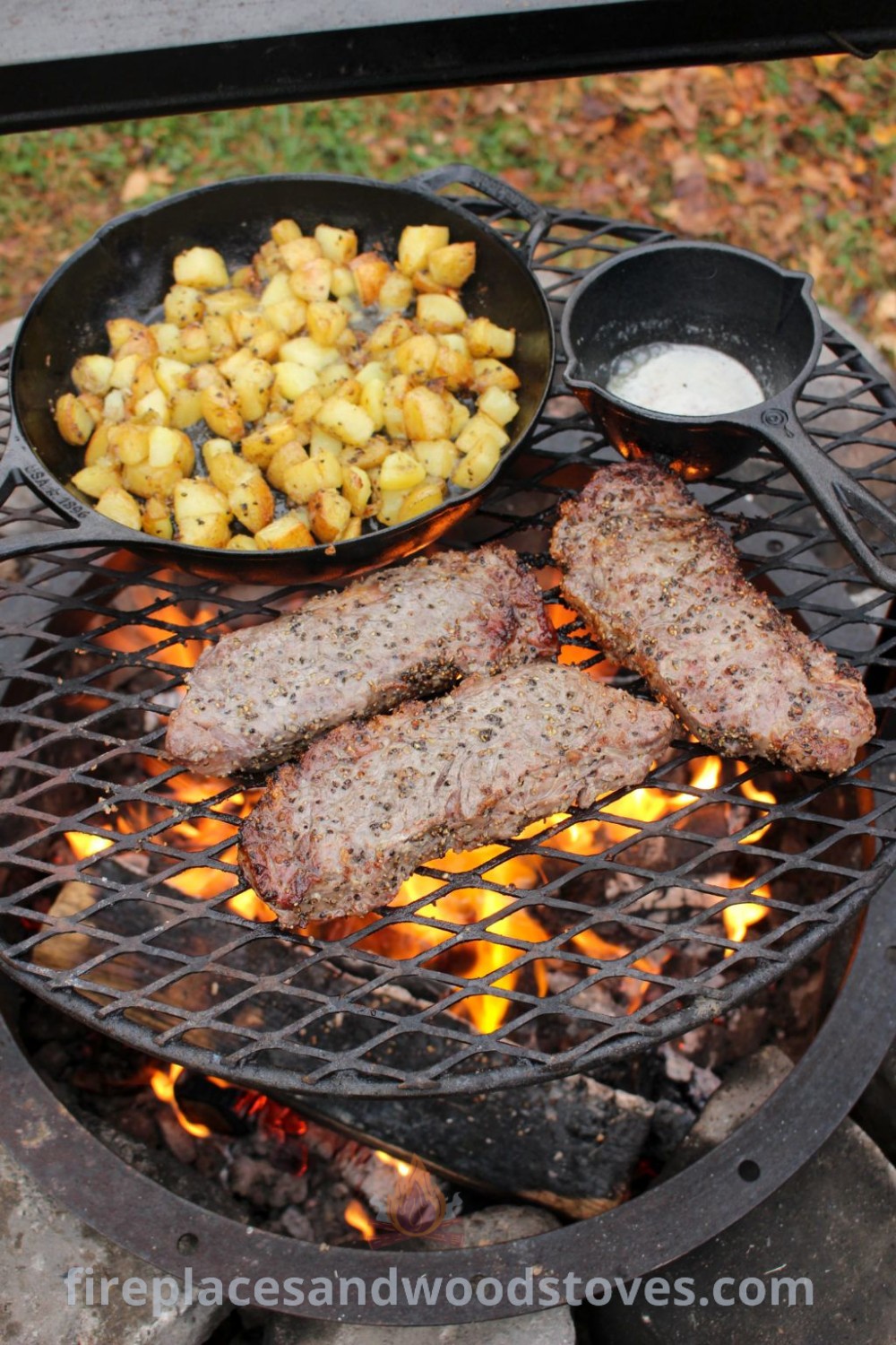 A deliciously grilled meat and potatoes spread on an outdoor grill, showcasing a cozy backyard setup perfect for gatherings. Enhance your outdoor cooking experience with stylish designs that wow your guests. For more ideas and inspiration, visit patioandhomefurniture.com.