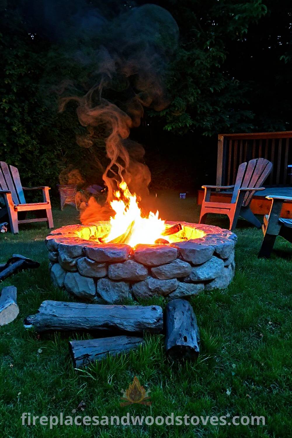 Stone fire pit nestled in a lush backyard creating a cozy and inviting atmosphere with flickering flames, mismatched chairs, and the scent of burning wood, perfect for gathering with friends. Visit patioandhomefurniture.com for incredible ideas that will wow your guests.