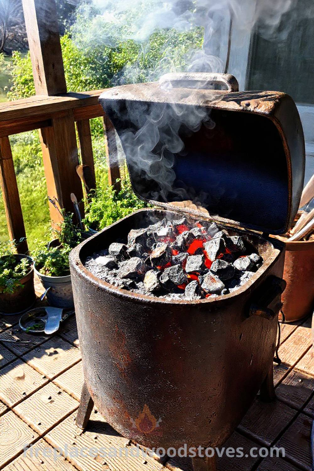 Old charcoal barbecue smoker on a weathered wooden deck, surrounded by potted herbs and grilling tools, creating a cozy and inviting atmosphere for outdoor gatherings. Visit patioandhomefurniture.com for incredible ideas that will wow your guests and transform your backyard.