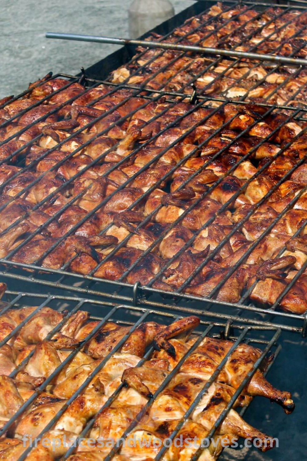 Cooking chicken on the grill with tongs, representing a BBQ party atmosphere. Discover creative outdoor cooking ideas and stylish barbeque designs that transform your backyard into an inviting space at patioandhomefurniture.com.