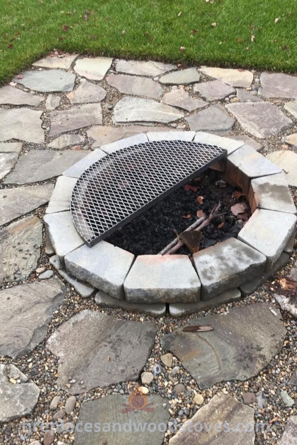 A stylish fire pit on a stone walkway enhances outdoor living, ideal for BBQs and cozy gatherings. Transform your backyard with this incredible design from patioandhomefurniture.com.