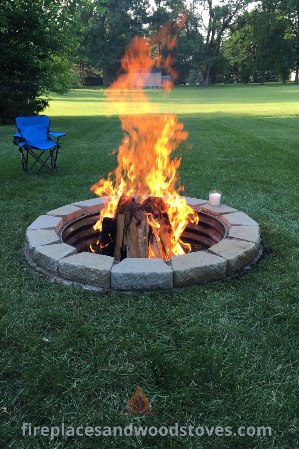 A fire pit sitting on top of a lush green field, creating a cozy outdoor seating area perfect for gatherings. Discover stylish firepit designs and yard decoration ideas that transform your backyard into a delightful retreat. Visit patioandhomefurniture.com for more inspiring outdoor fire pit ideas.