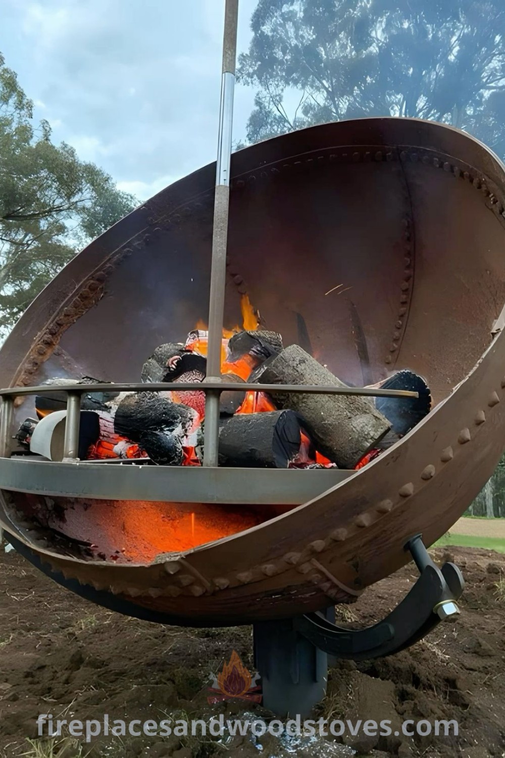 A large metal fire bowl sitting on a pile of dirt, providing warmth and ambiance in an outdoor setting. Discover stylish outdoor decor ideas that enhance your patio at patioandhomefurniture.com.