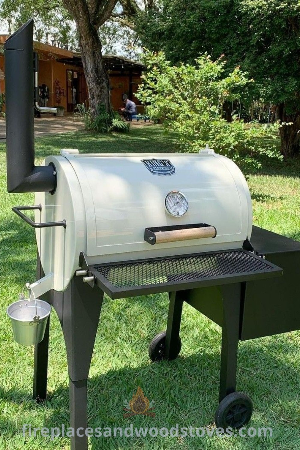 An outdoor BBQ grill in the grass, ideal for grilling and pizza preparation, complemented by stylish light fixtures. The scene showcases creative outdoor decor ideas transforming your backyard space into a functional and inviting area for entertaining guests. Discover more outdoor inspiration at patioandhomefurniture.com.