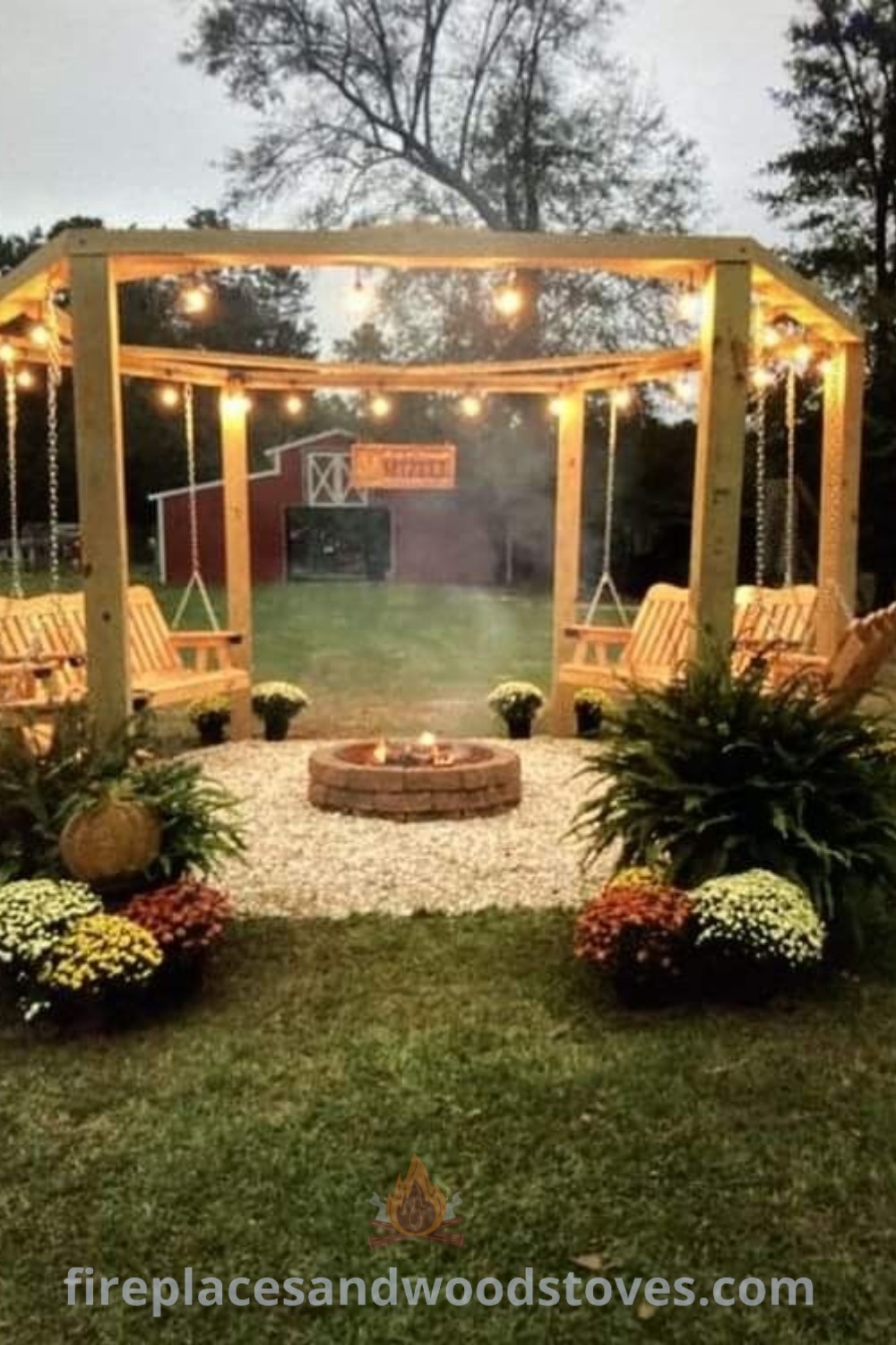 An outdoor fire pit area surrounded by plants and hanging lights in the evening, with chairs arranged for cozy gatherings. Stylish designs transforming your backyard into an inviting retreat. Discover incredible outdoor fire pit ideas at patioandhomefurniture.com.