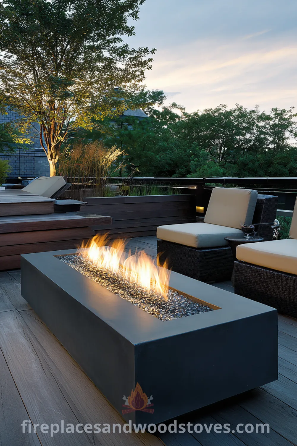Minimalist fire pit on a sleek deck, surrounded by modern lounge chairs and glass beads for a serene outdoor space.