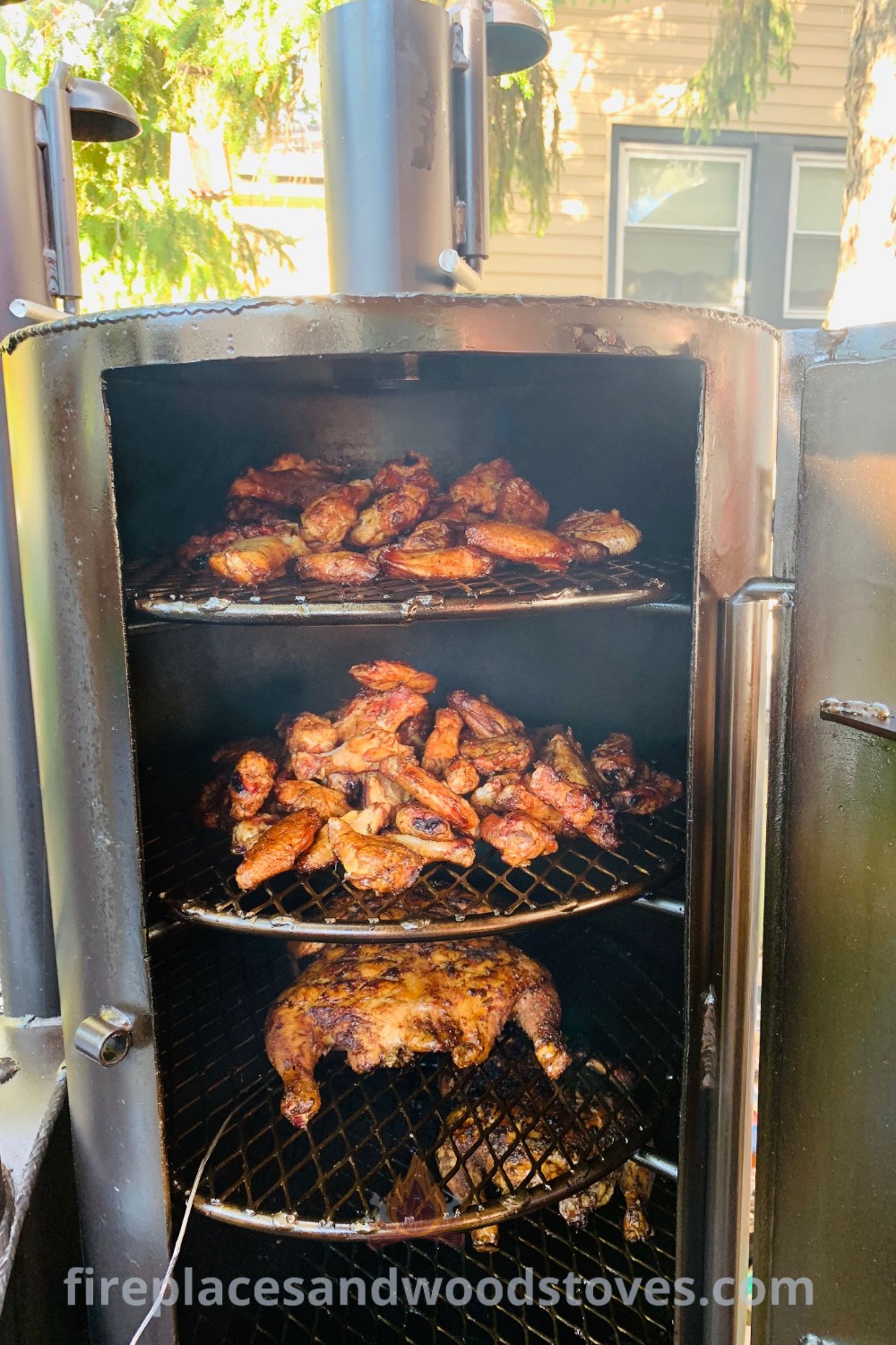 A chicken being cooked on the grill using homemade smoker plans, showcasing stylish backyard barbecue ideas. Transform your outdoor space with these incredible smoker designs for unforgettable meals. More inspiration available at patioandhomefurniture.com.