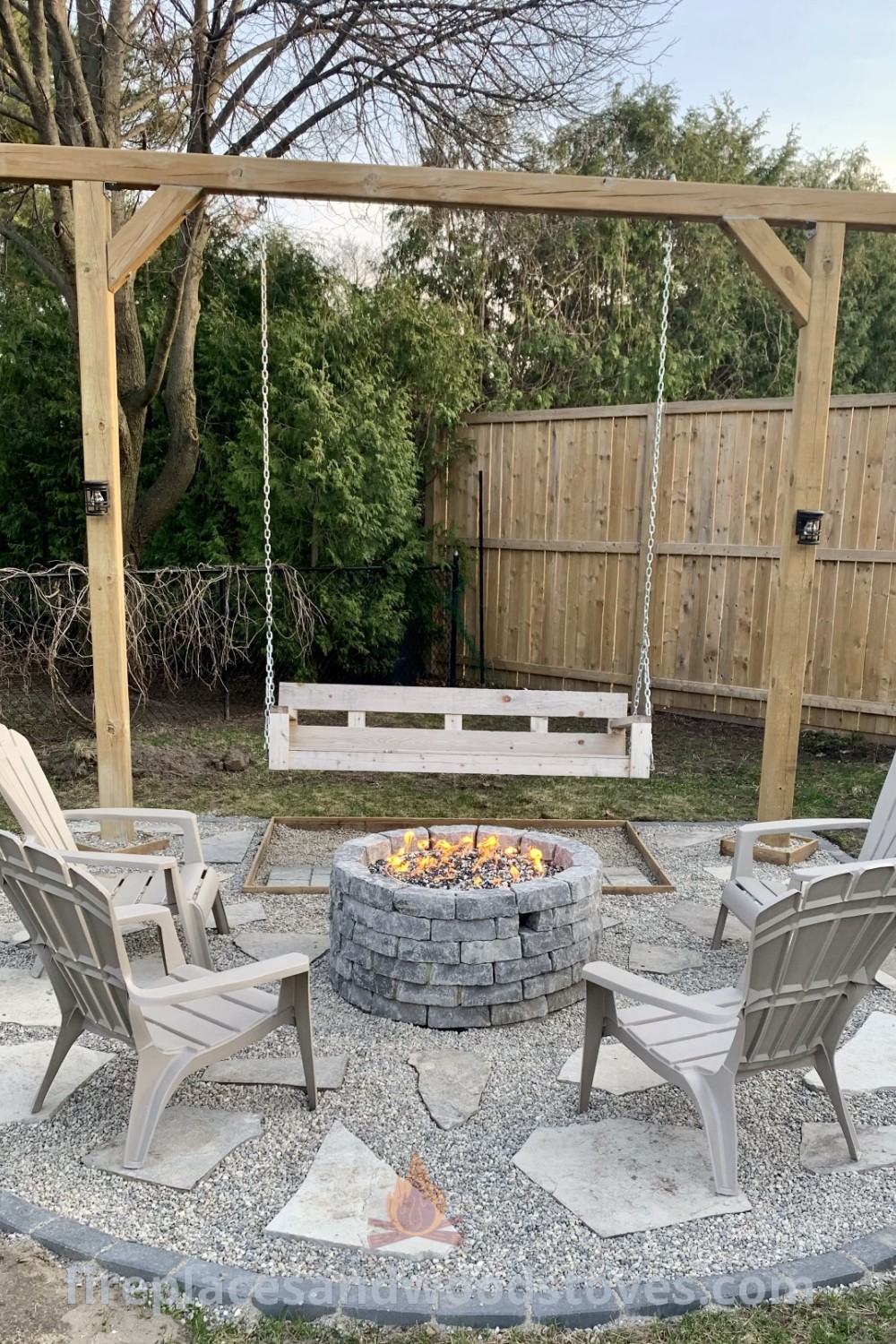 A cozy outdoor fire pit area with chairs and a wooden arbor featuring a swing, elegantly designed for relaxation and entertainment. Enhance your backyard seating area with stylish decor and lighting ideas to impress your guests. Discover more outdoor inspiration at patioandhomefurniture.com.