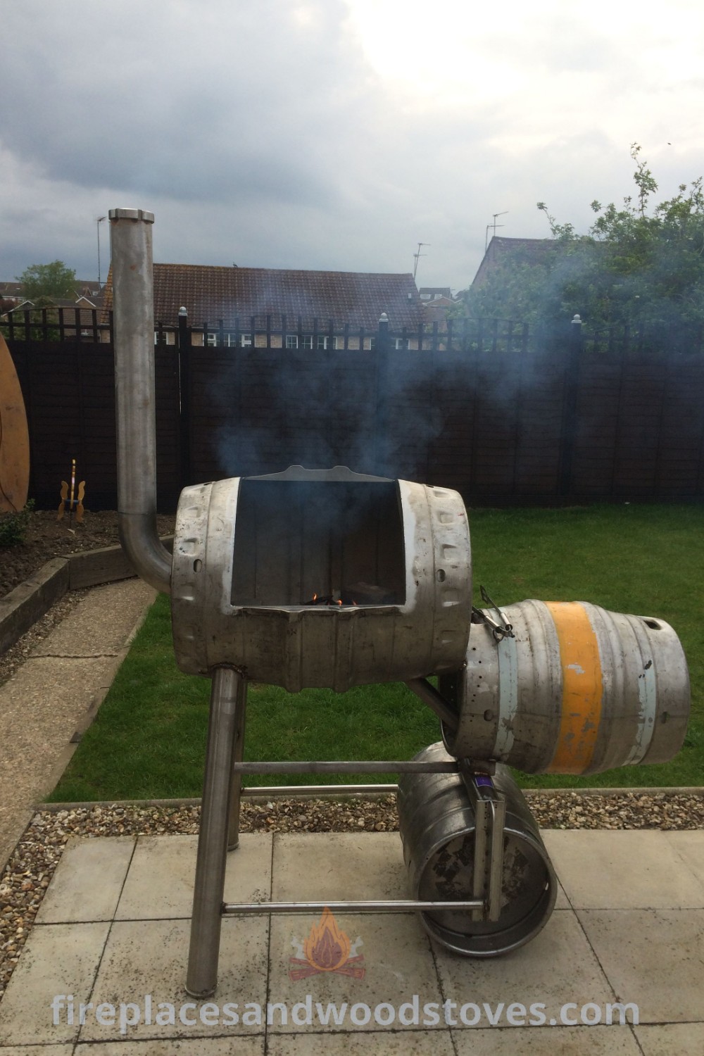 A DIY barrel smoker in an outdoor setting, showcasing creative designs for smoking meat in style. Ideal for backyard BBQ enthusiasts seeking to enhance their culinary experience. Discover more ideas at patioandhomefurniture.com.