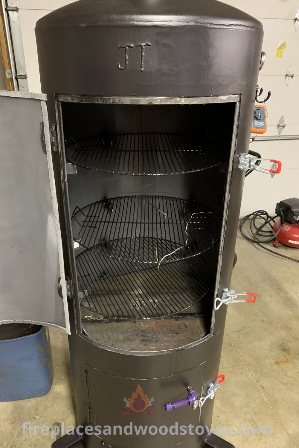 An outdoor charcoal smoker in a garage, showcasing a stylish design perfect for enhancing your outdoor kitchen grill experience and BBQ parties. Discover more creative outdoor ideas for your grilling space at patioandhomefurniture.com.