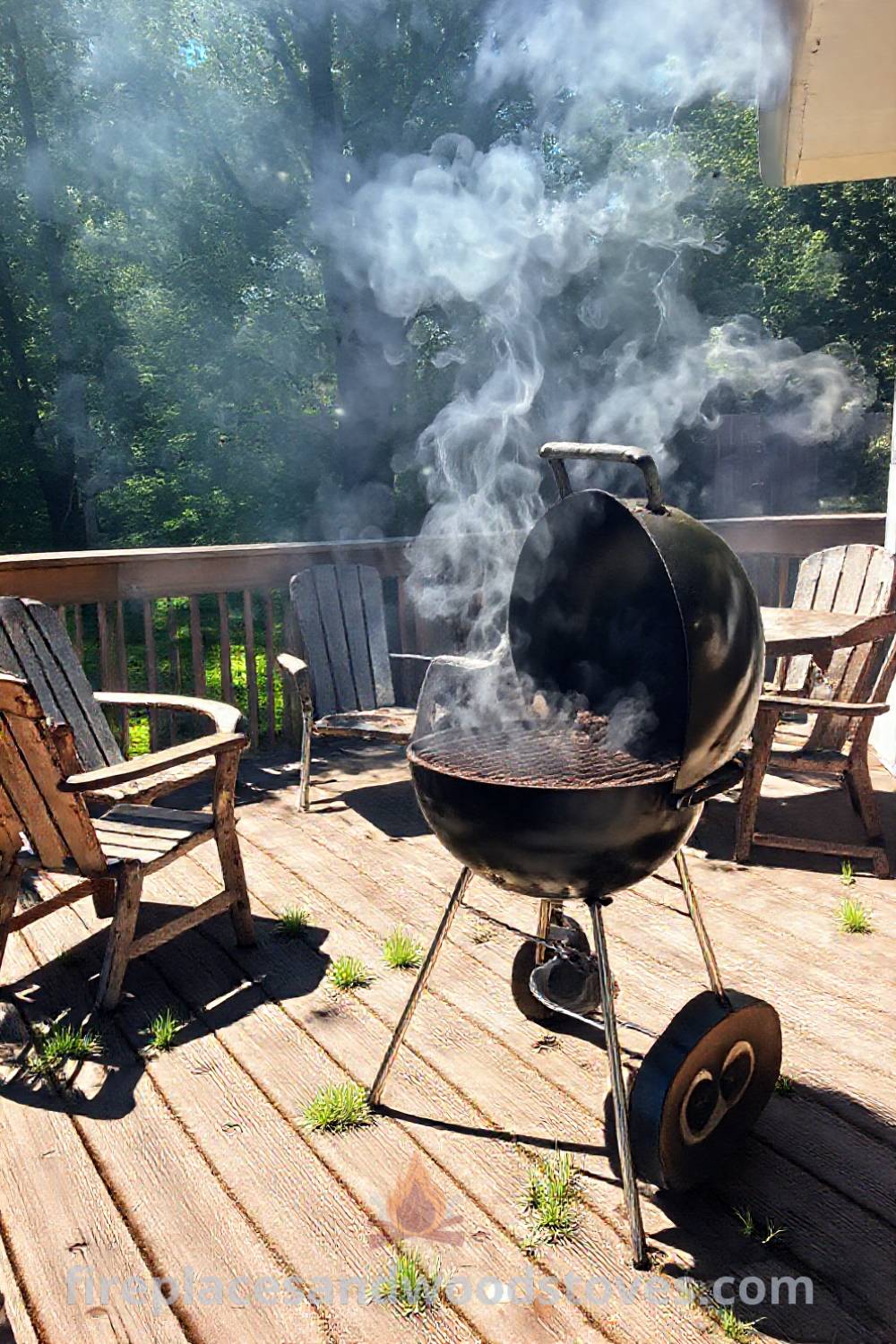 Classic charcoal grill in a sunlit backyard with blackened grates, smoke wafting above, mismatched chairs, and a weathered table inviting gatherings, showcasing incredible outdoor design ideas for a cozy and stylish space. Visit patioandhomefurniture.com for more inspiration.