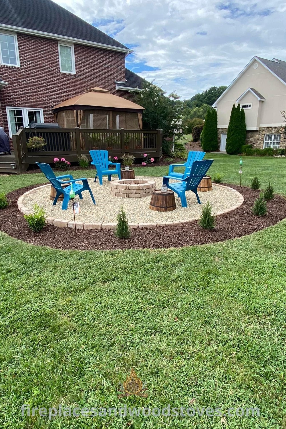 An outdoor fire pit surrounded by lawn chairs, perfect for creating a cozy gathering space in your backyard. This stylish setup enhances fire pit landscaping and invites social interactions. Discover more incredible outdoor ideas at patioandhomefurniture.com.