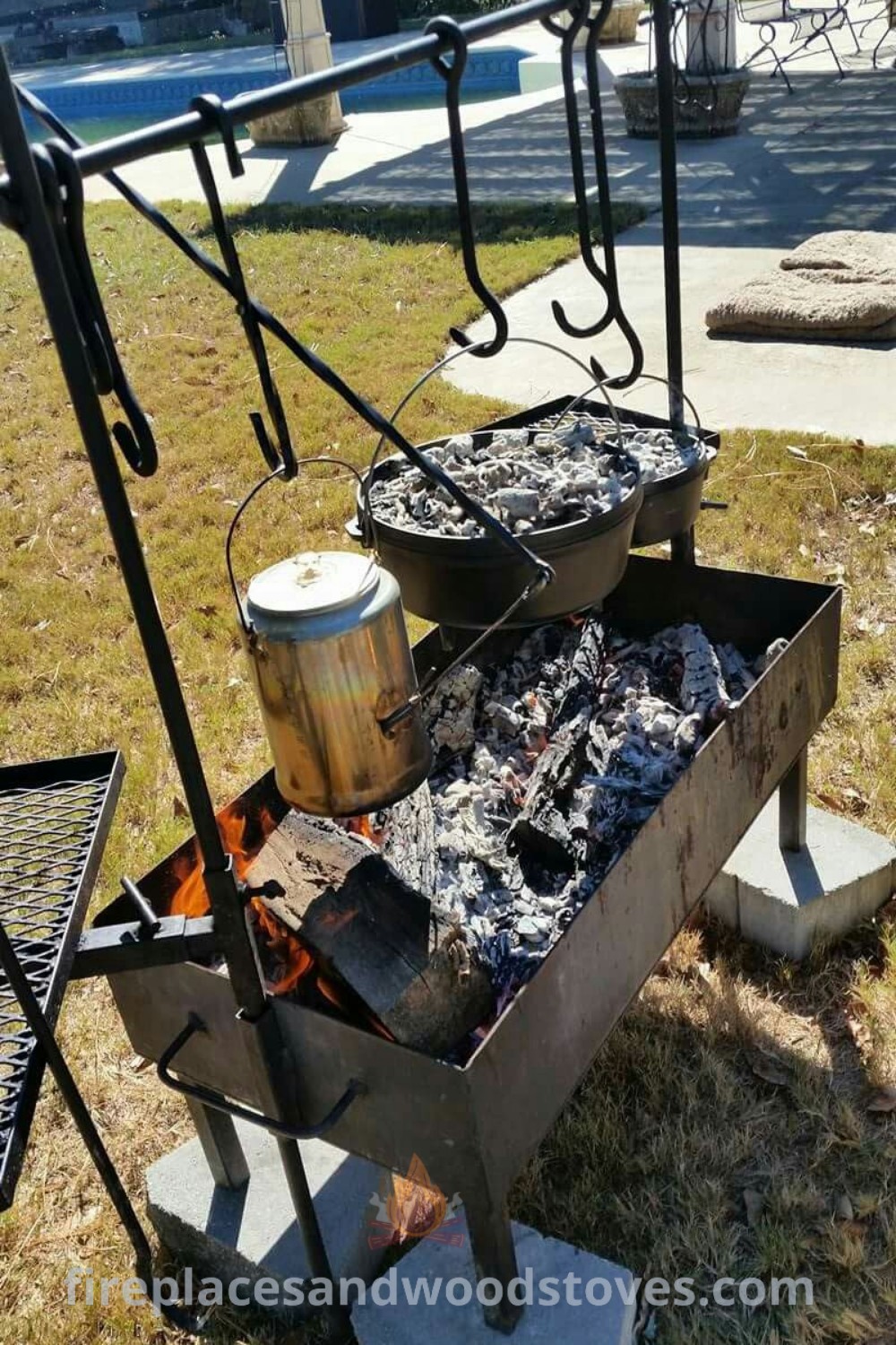 An outdoor grill with pots and pans cooking on its burners in the grass, showcasing stylish outdoor cooking ideas and camp cooking gear. Transform your backyard with incredible ideas for cozy outdoor gatherings. Explore more at patioandhomefurniture.com.