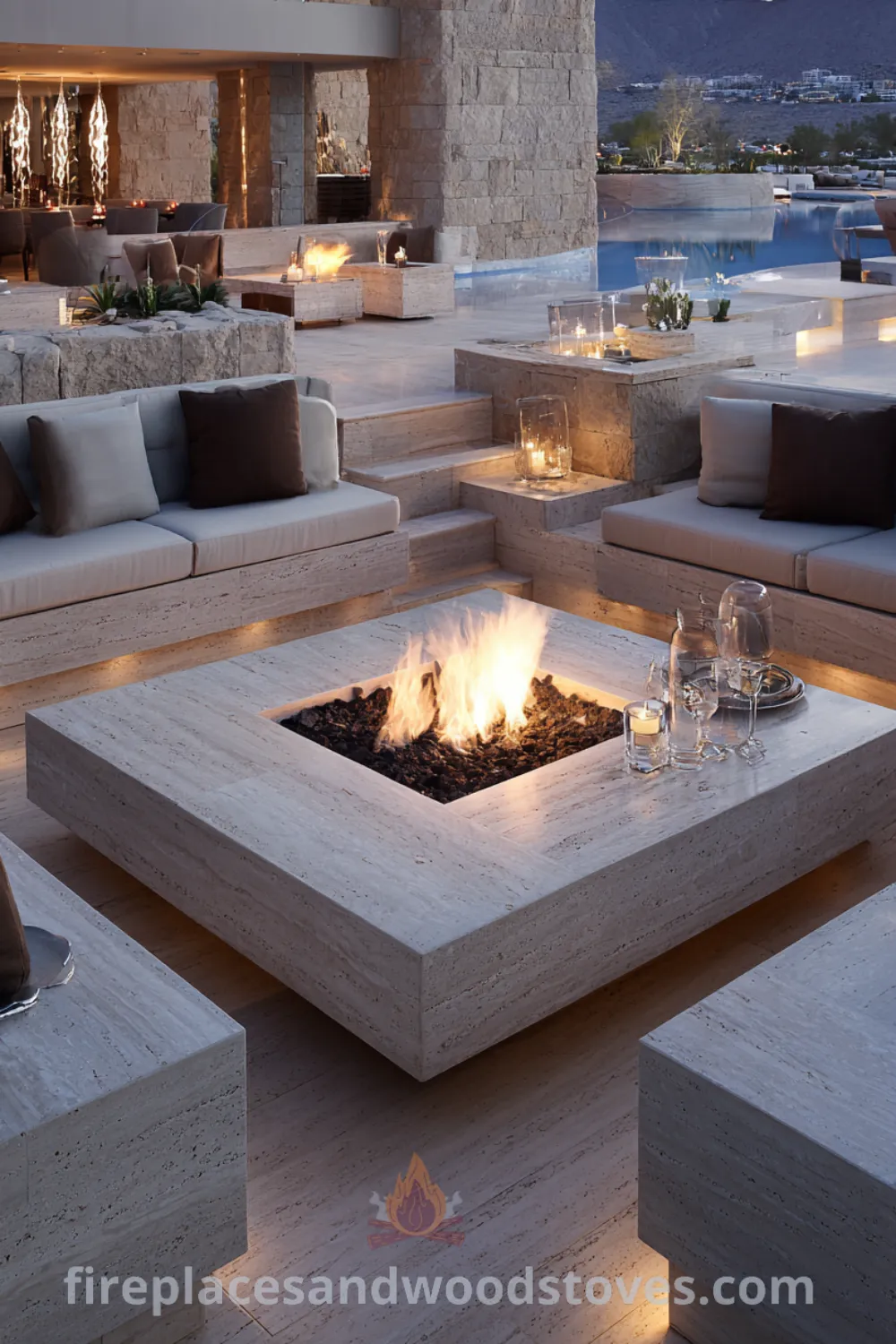 Outdoor lounge with a modern luxury fire pit, high-end furniture, honed travertine, and sophisticated fire pit area.