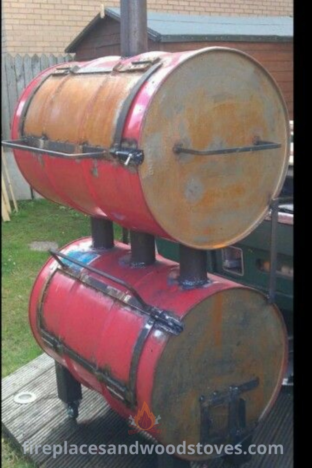 Two large barrels stacked on top of each other serving as stylish BBQ smokers, showcasing a functional design for an outdoor kitchen. Enhance your patio with these incredible ideas from patioandhomefurniture.com.
