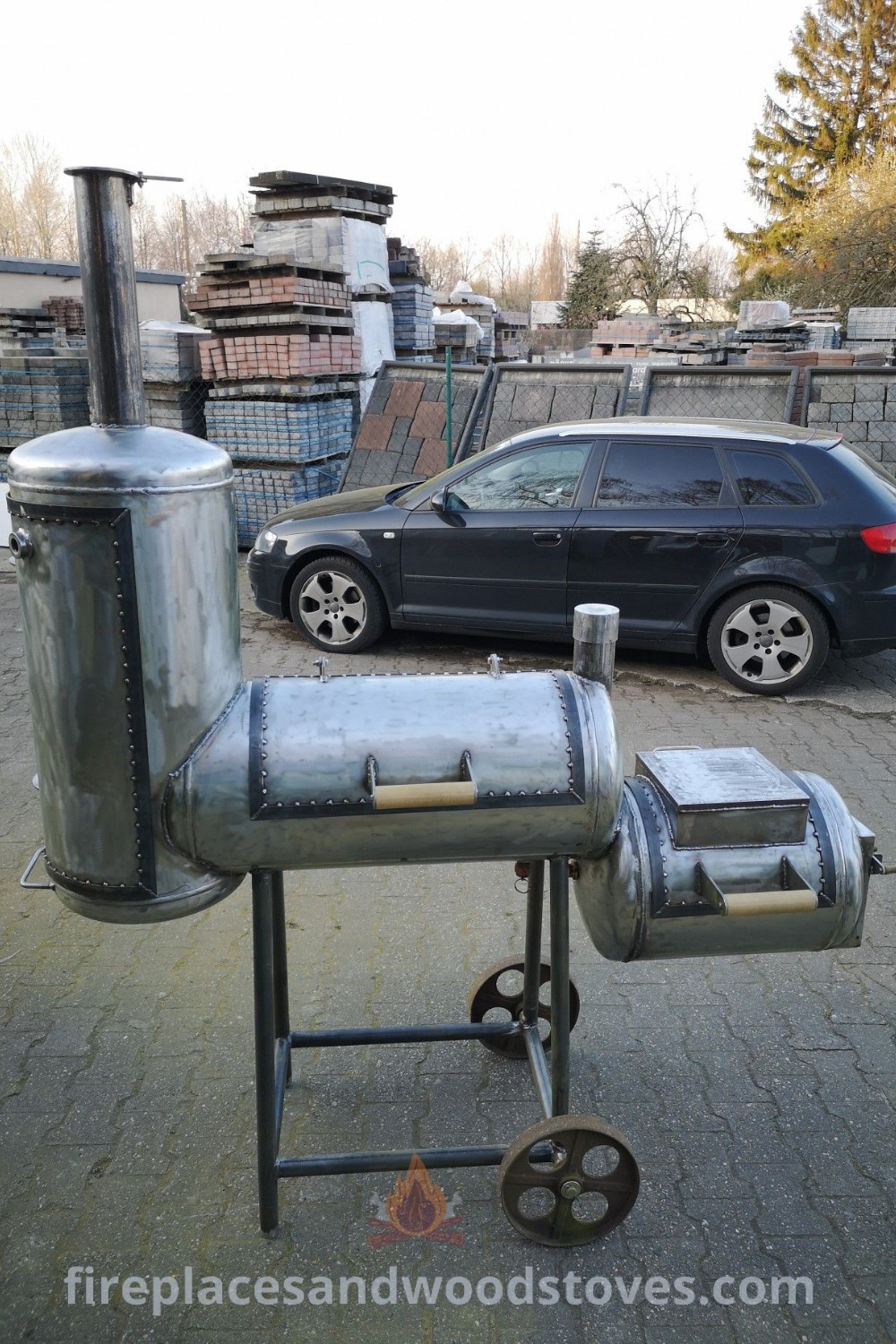 A custom BBQ grill set up in front of a metal object, featuring stylish designs and a reverse flow smoker, creating a perfect outdoor cooking space for entertaining. Discover more backyard BBQ ideas at patioandhomefurniture.com.