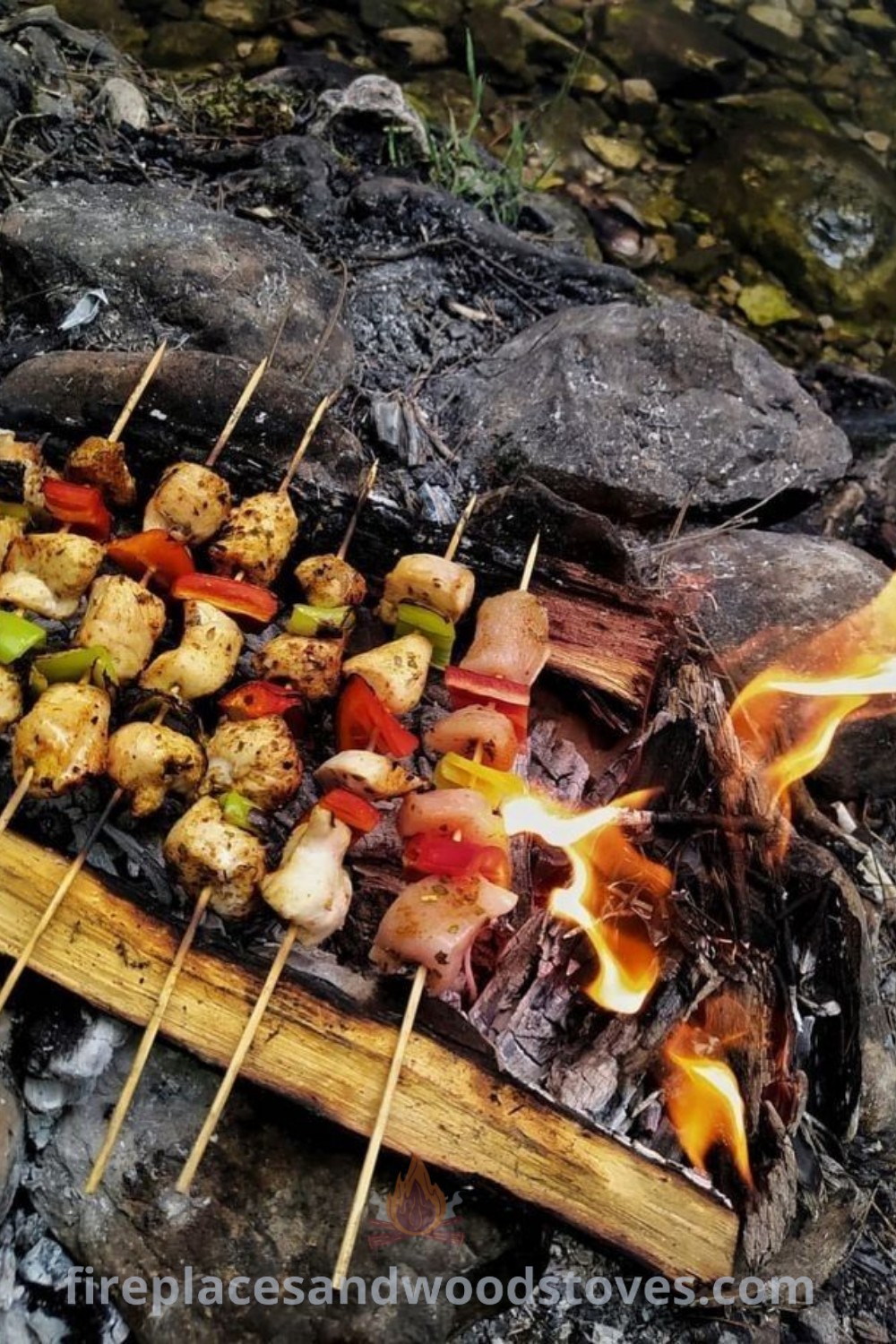 Skewers of meat and vegetables cooking over an open fire, exemplifying fancy camping food and campfire cuisine. Discover incredible and cozy ideas for camping snacks at patioandhomefurniture.com.