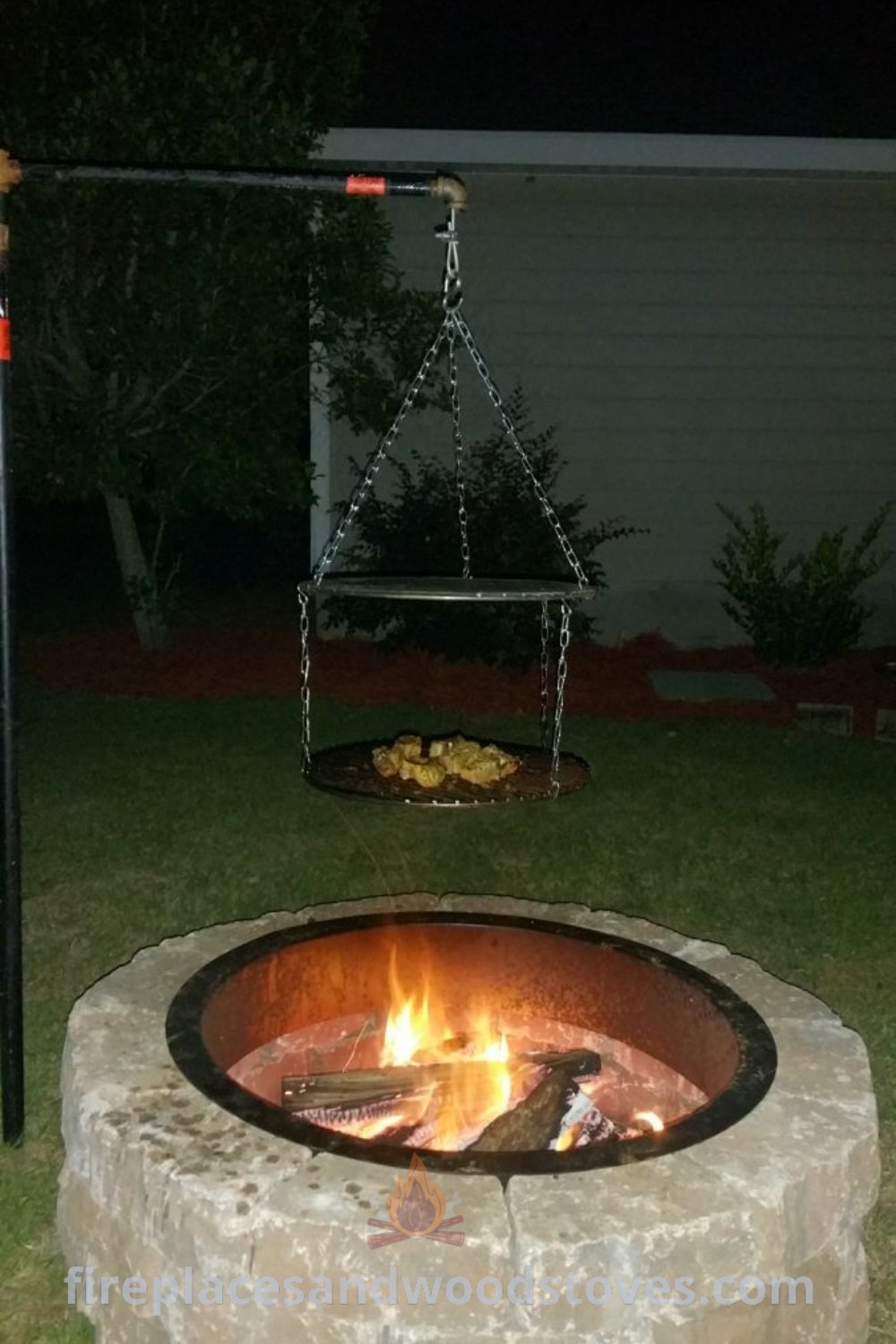 A charming fire pit in a backyard surrounded by a swing set, creating a cozy and inviting outdoor space. Perfect for gatherings, this stylish design enhances home decor and offers incredible ideas for creating a warm atmosphere. More inspiration available at patioandhomefurniture.com.