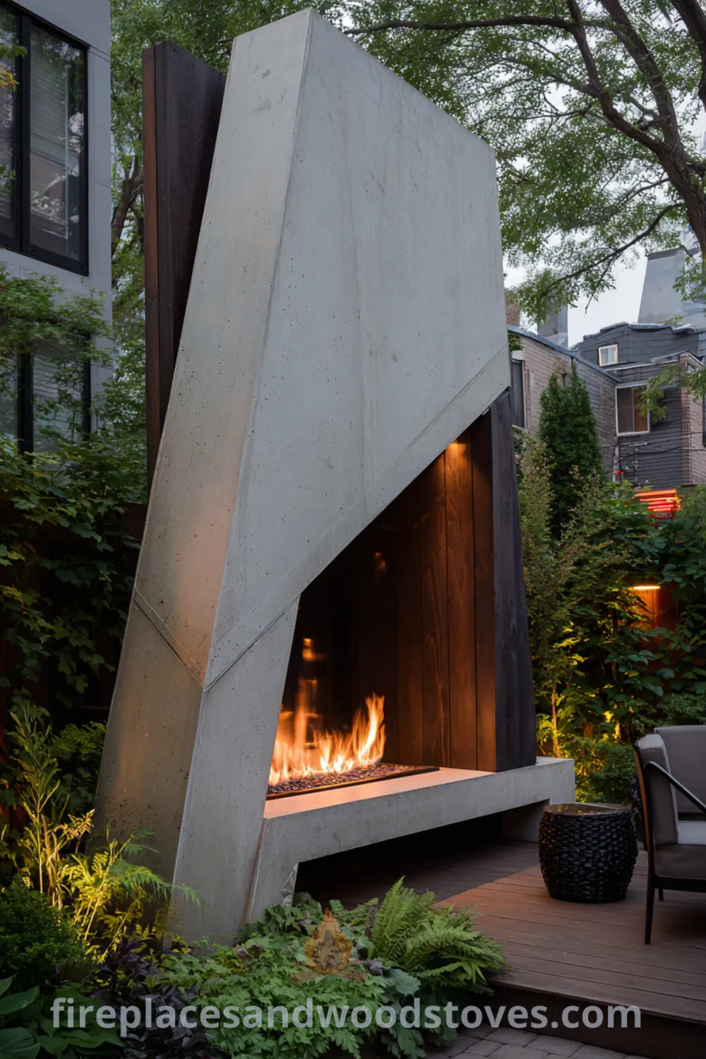 Asymmetrical modern minimalist outdoor fireplace made from light concrete and dark wood cladding in an urban backyard, highlighting lush greenery and inviting outdoor space.