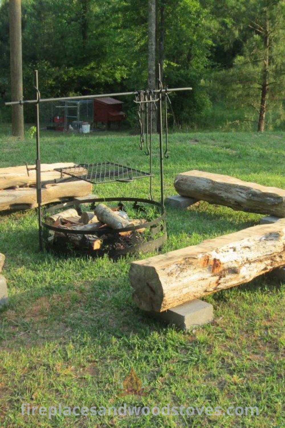 A group of log benches surrounding a rustic fire pit on a lush green field, perfect for cozy outdoor gatherings. Enhance your backyard with stylish fire pit landscaping ideas and log seating. Discover more inspiration at patioandhomefurniture.com.