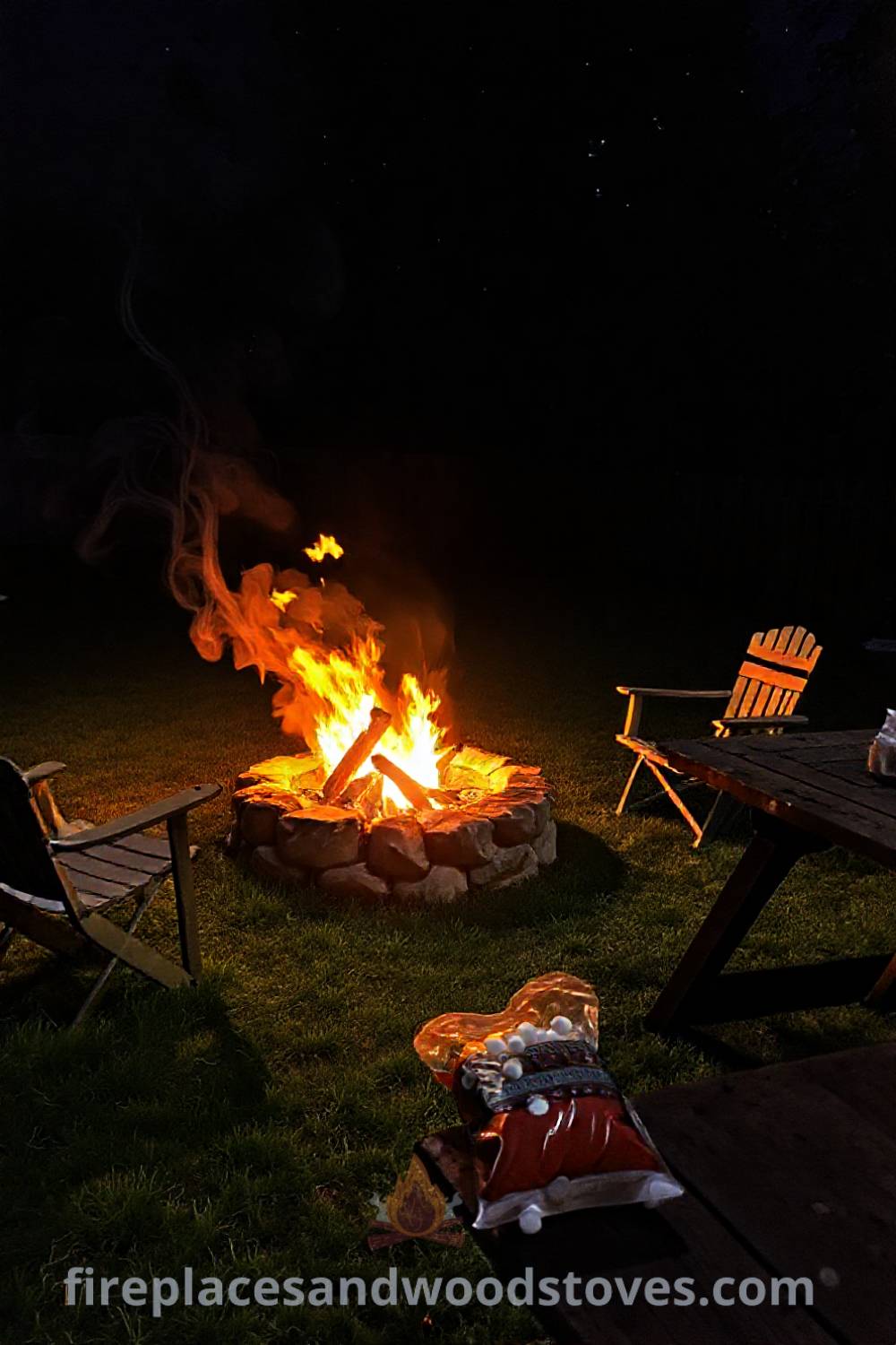 Backyard camping scene featuring a wood-burning fire pit surrounded by worn folding chairs, a rustic picnic table with marshmallows, creating a cozy and inviting outdoor atmosphere perfect for gatherings. Discover stylish outdoor ideas and inspiration at patioandhomefurniture.com.