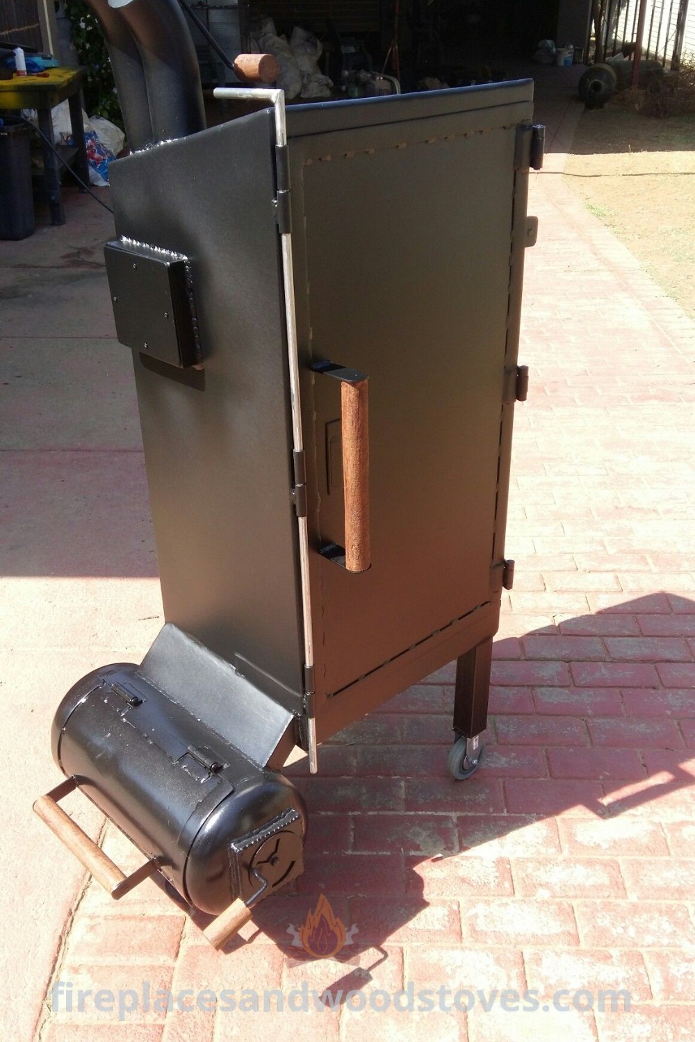An outdoor BBQ grill on a brick walkway, showcasing a wood grill table and smoker designs, ideal for creating memorable summer gatherings. Discover custom BBQ smokers and outdoor grill ideas at patioandhomefurniture.com.
