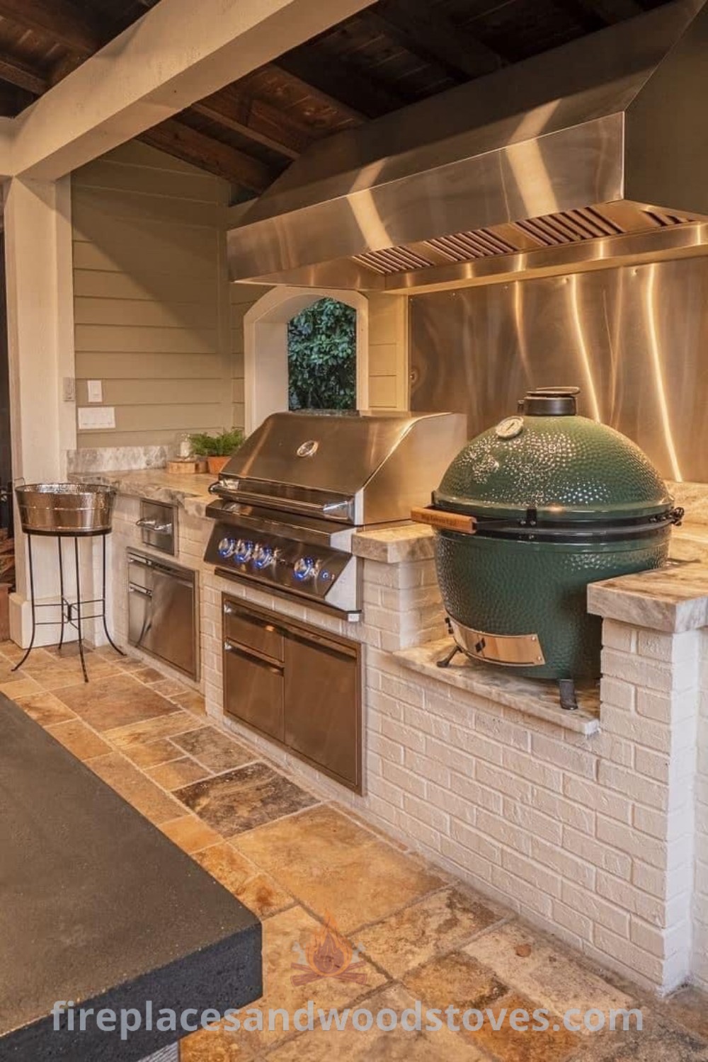 An outdoor kitchen with stainless steel appliances and grill, complemented by an outdoor pizza oven, covered cooking area, and stylish backsplash, creating a luxurious space for entertaining. Discover ideas that will wow your guests at patioandhomefurniture.com.