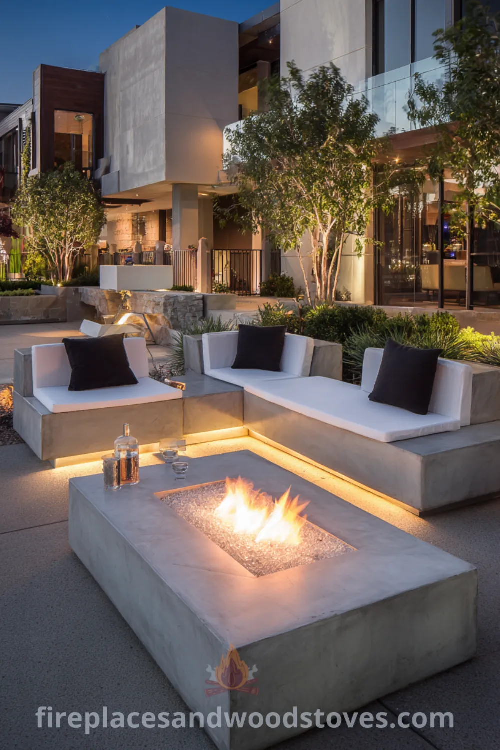 Outdoor living room featuring a modern minimalist fire pit, smooth concrete surfaces, sleek low furniture, and serene fire pit area ambiance.
