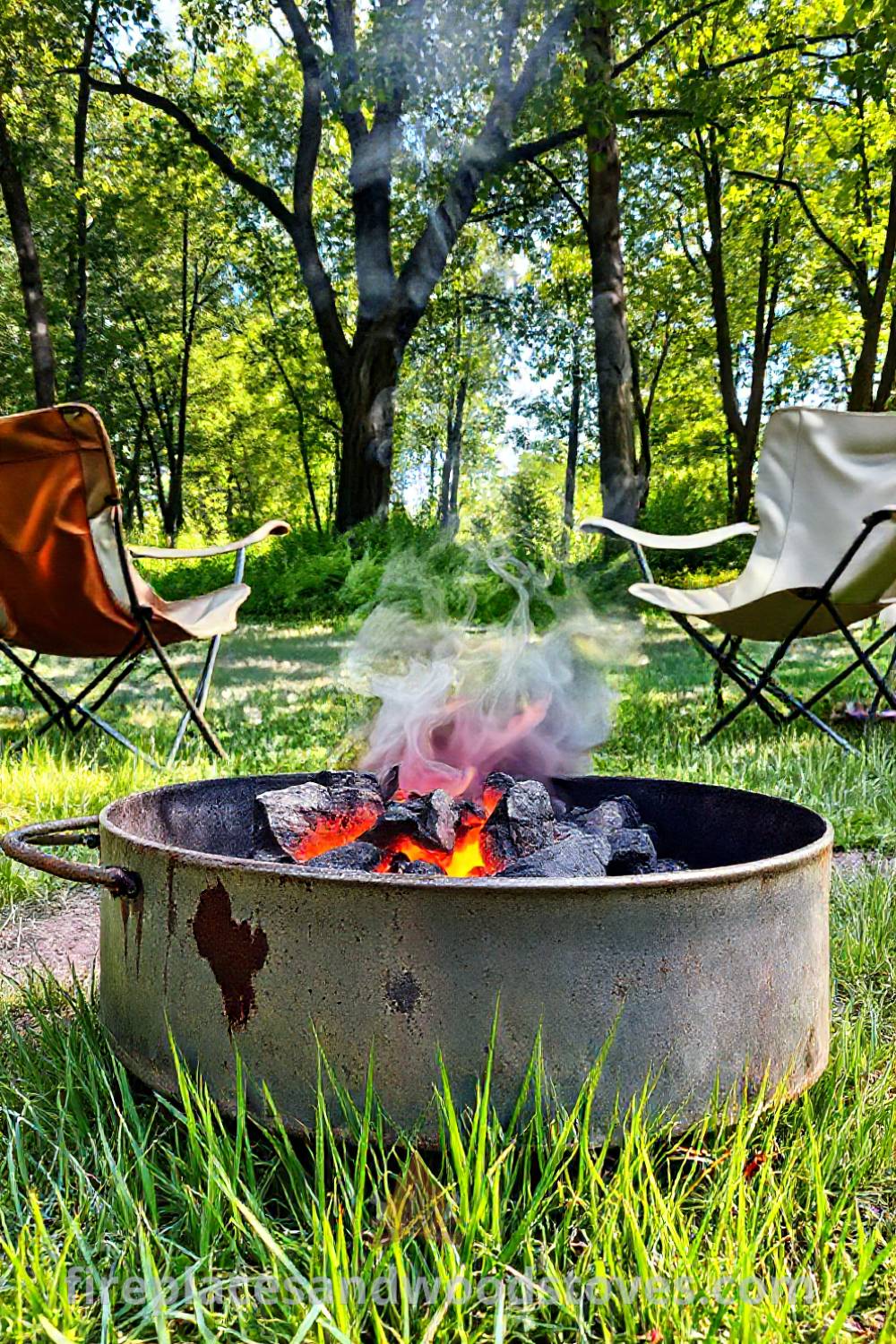 A sturdy camping barbecue with glowing charcoal and flickering flames sits on sun-drenched grass, surrounded by worn canvas camping chairs, creating a cozy outdoor gathering atmosphere. Visit patioandhomefurniture.com for stylish designs transforming your backyard.