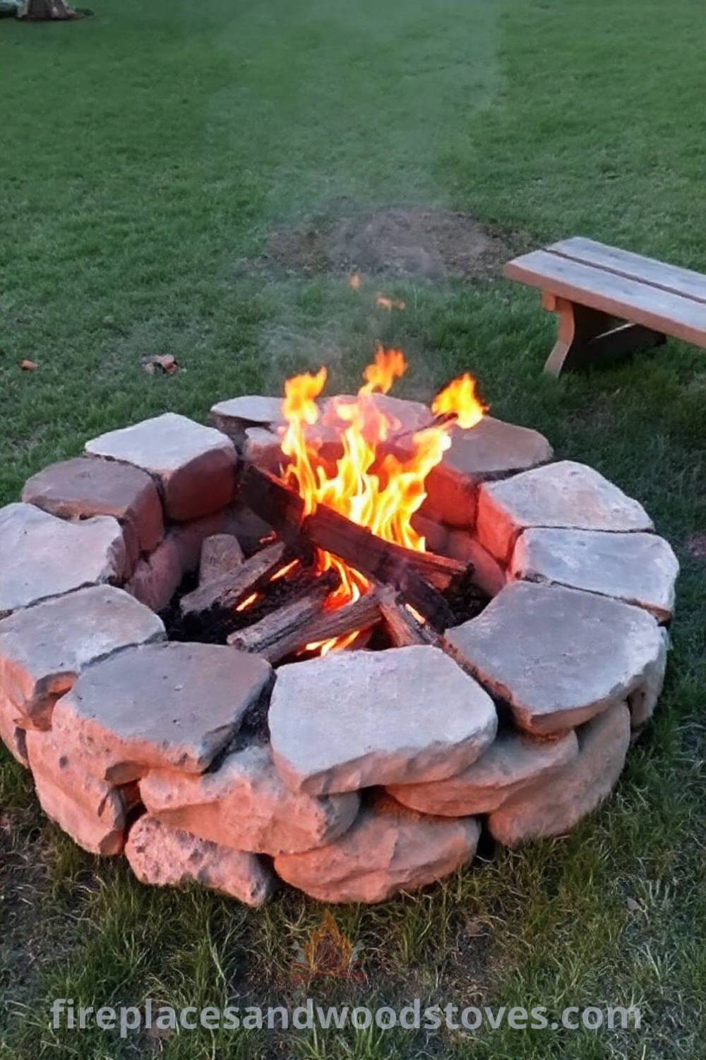 Classic backyard fire pit made of weathered stone surrounded by grassy areas and wooden benches, creating a cozy outdoor space for gatherings and storytelling, perfect for transforming your backyard. Visit patioandhomefurniture.com for stylish inspiration and ideas you