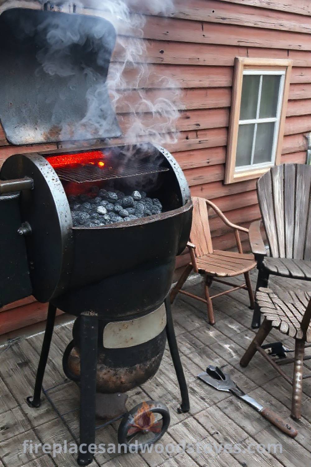 Robust barbecue smoker on a weathered wooden patio, surrounded by mismatched chairs and tools, creating a cozy and inviting outdoor space for shared meals and gatherings. Visit patioandhomefurniture.com for incredible ideas that will wow your guests.