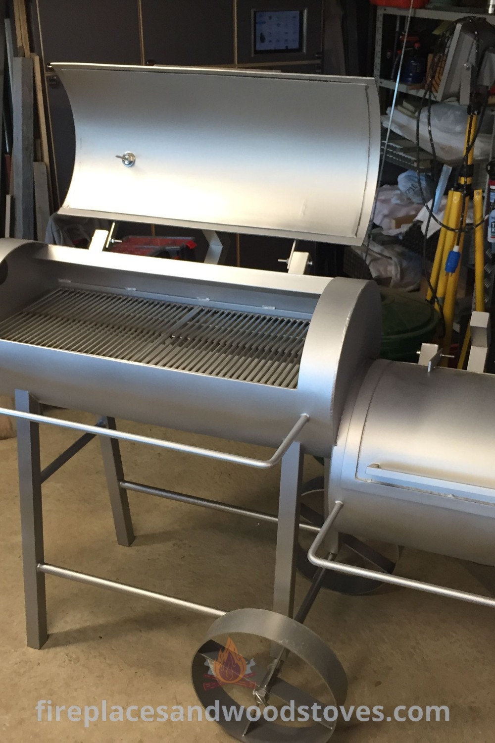 A large grill inside a garage, showcasing a custom BBQ smoker. Perfect for outdoor cooking and entertaining, this setup transforms your backyard with stylish and functional designs. Explore incredible outdoor ideas at patioandhomefurniture.com.