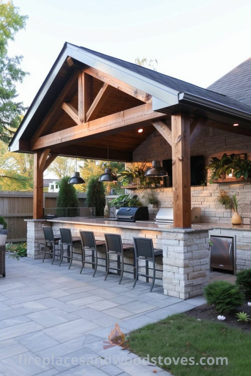An outdoor kitchen and grill area featuring tongue and groove design with chairs; perfect for stylish gatherings and entertaining. Discover more outdoor kitchen ideas at patioandhomefurniture.com.