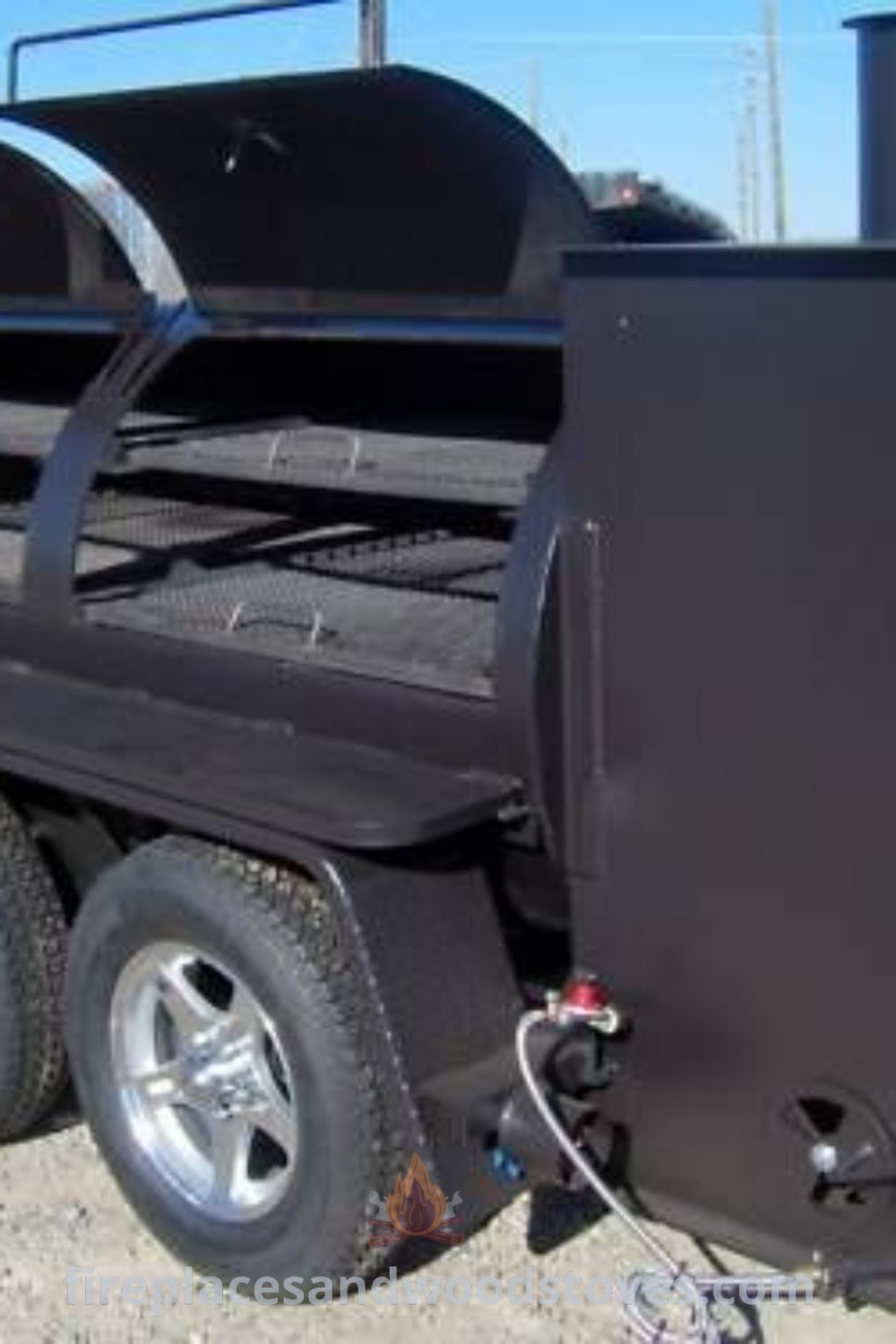 A black trailer smoker parked on gravel, showcasing stylish custom BBQ grill designs for outdoor cooking enthusiasts. Explore BBQ trailer ideas that enhance your outdoor space while offering functional benefits. Visit patioandhomefurniture.com for more smoker ideas and inspiration.