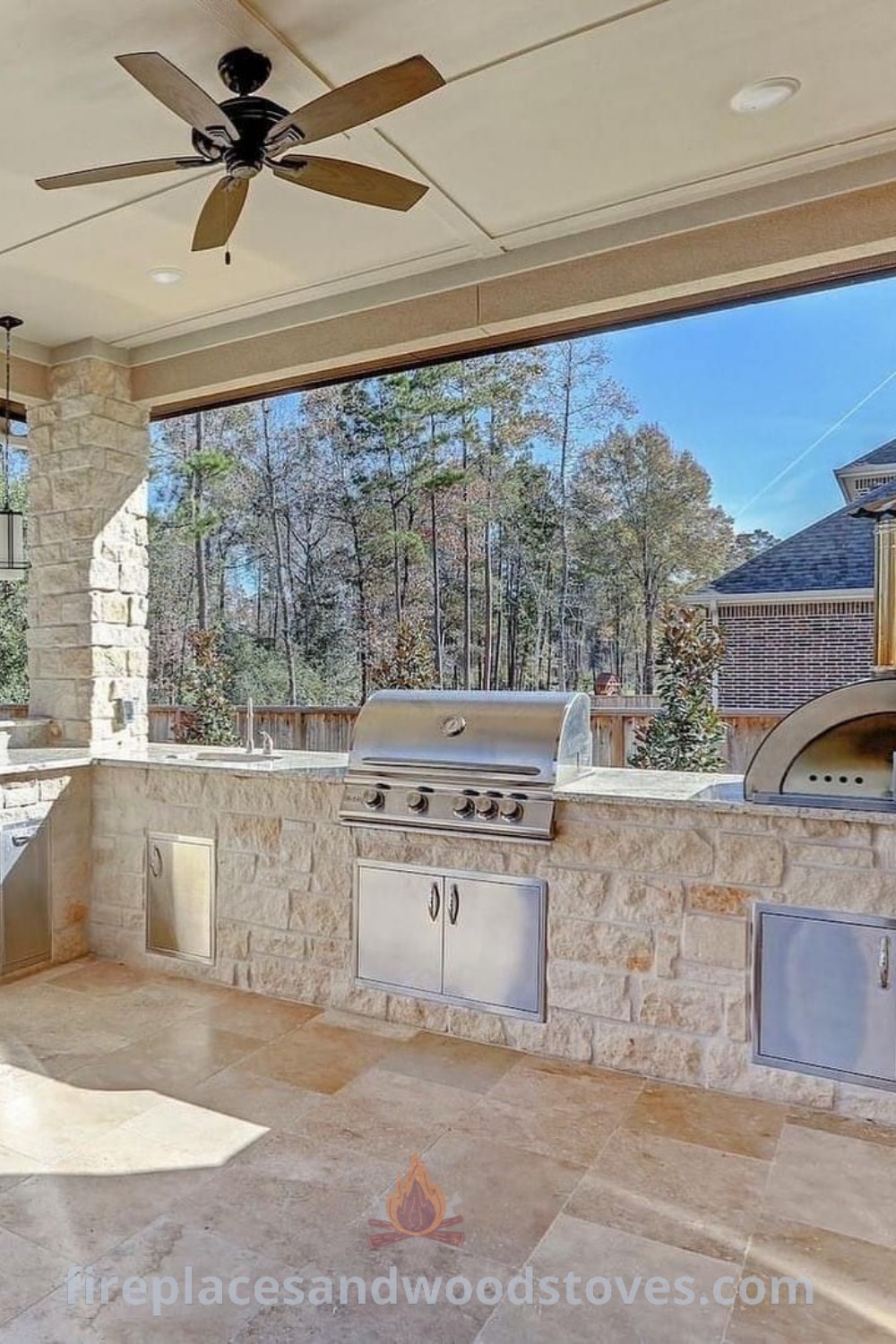 An outdoor kitchen with grills, sink, and ceiling fan, designed for luxurious cooking and entertaining, showcasing incredible outdoor kitchen ideas from patioandhomefurniture.com.
