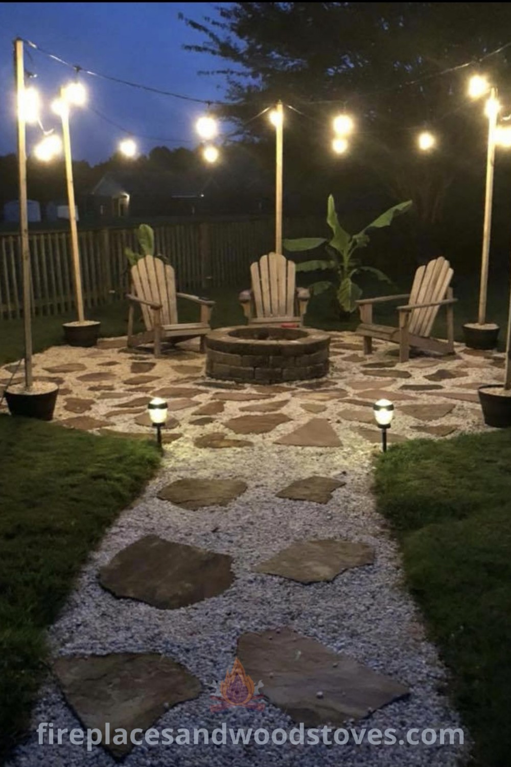 An outdoor fire pit surrounded by chairs and lights, designed for cozy gatherings in a modern rustic backyard. Ideal for landscape yard design and dirt backyard makeover DIY inspirations. Discover stylish outdoor ideas at patioandhomefurniture.com.