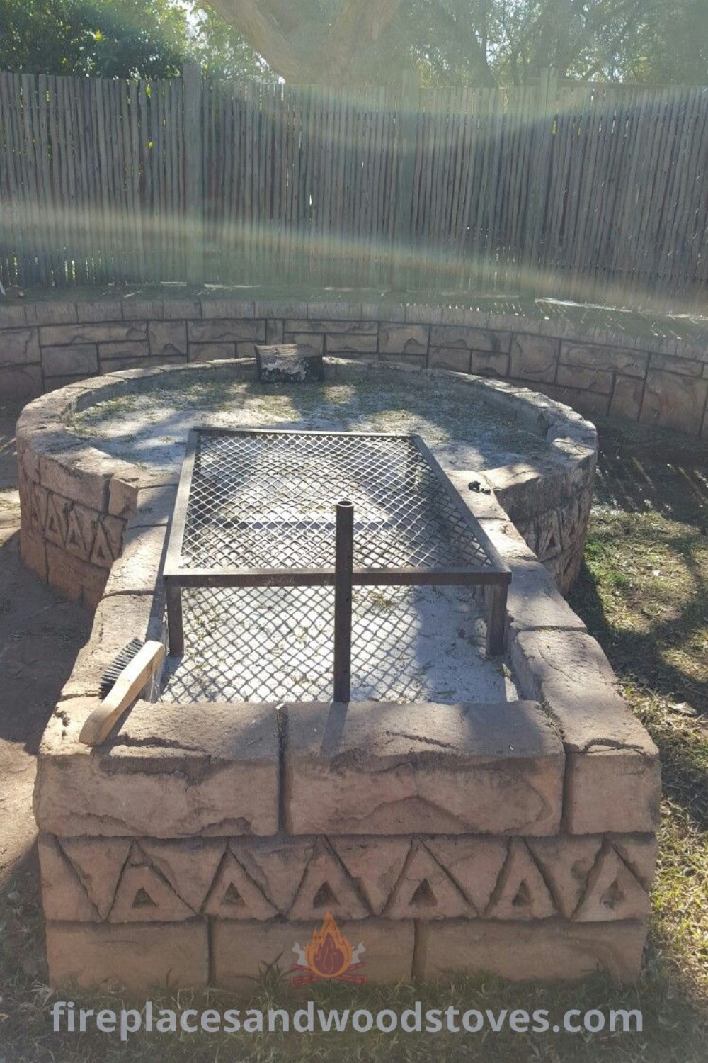An outdoor fire pit surrounded by decorative bricks and cement blocks, designed for cozy gatherings and BBQ cooking, enhancing your backyard