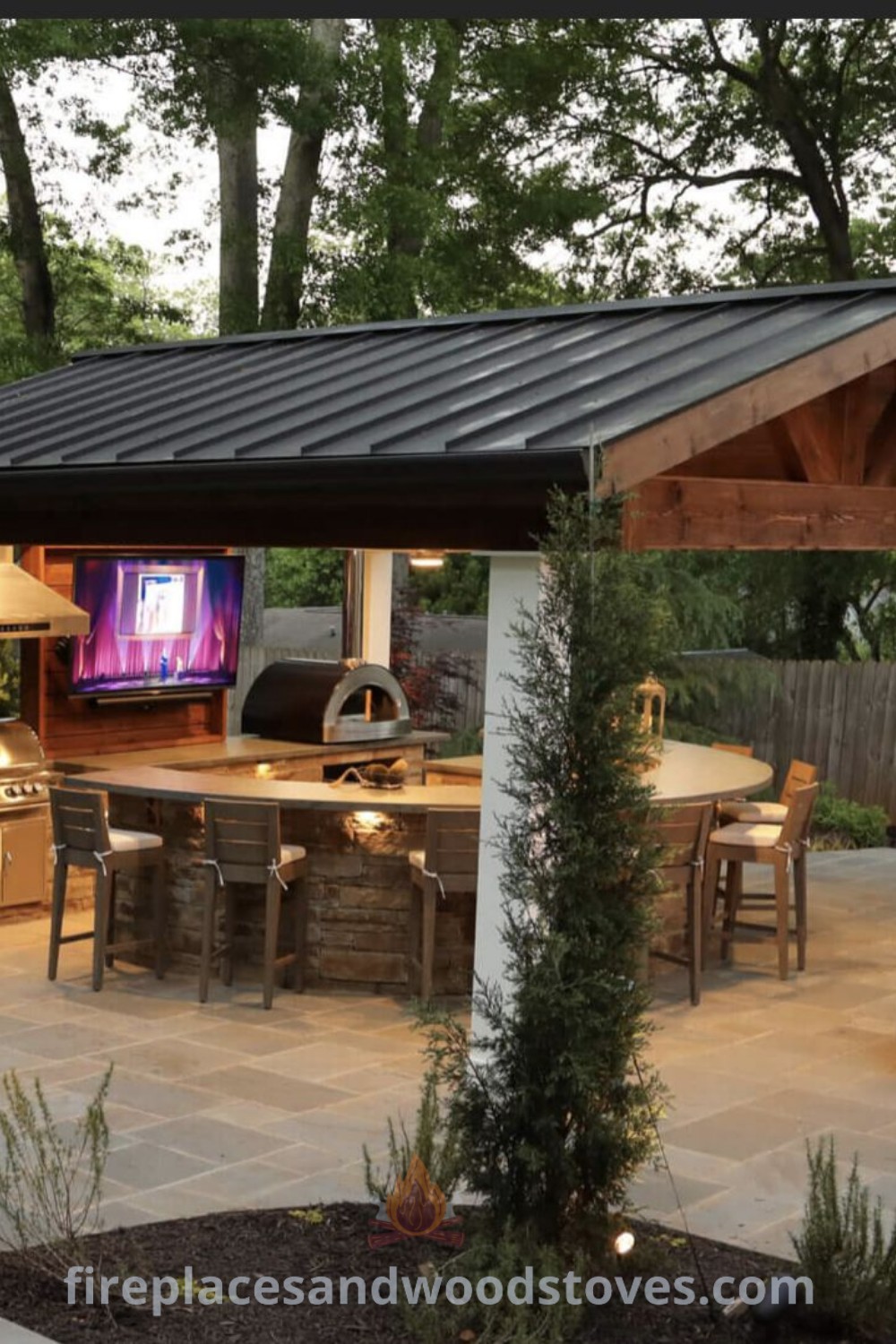 An outdoor kitchen and dining area featuring a covered grill area, patio with fireplace, and gazebo, illustrating stylish outdoor kitchen ideas and cozy outdoor living spaces. Discover inspiring outdoor kitchen designs at patioandhomefurniture.com.
