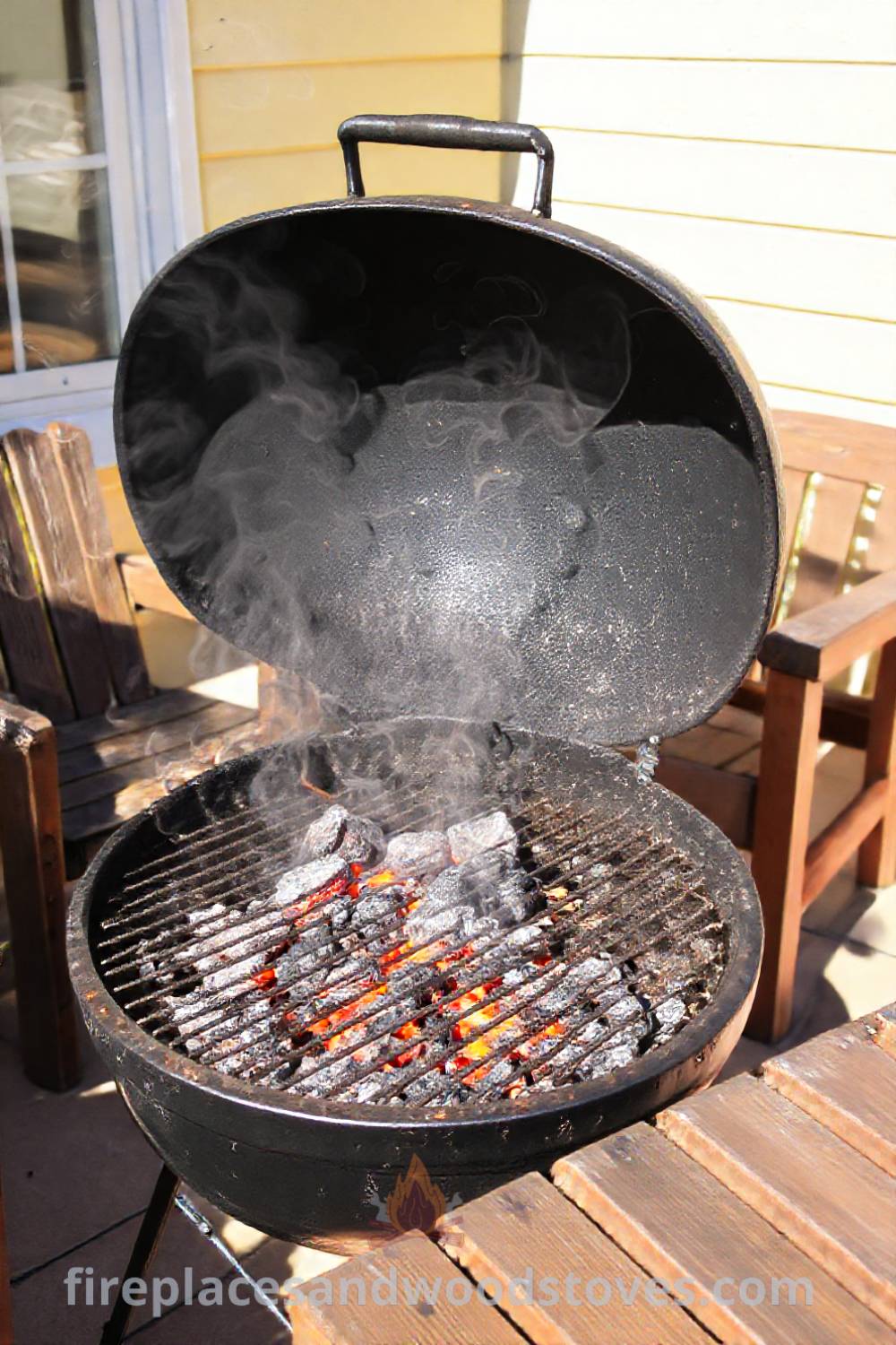 Classic charcoal grill barbecue on a sun-drenched patio with warm coals, surrounded by worn wooden furniture, creating a cozy atmosphere for gatherings. Visit patioandhomefurniture.com for stylish ideas that will wow your guests.