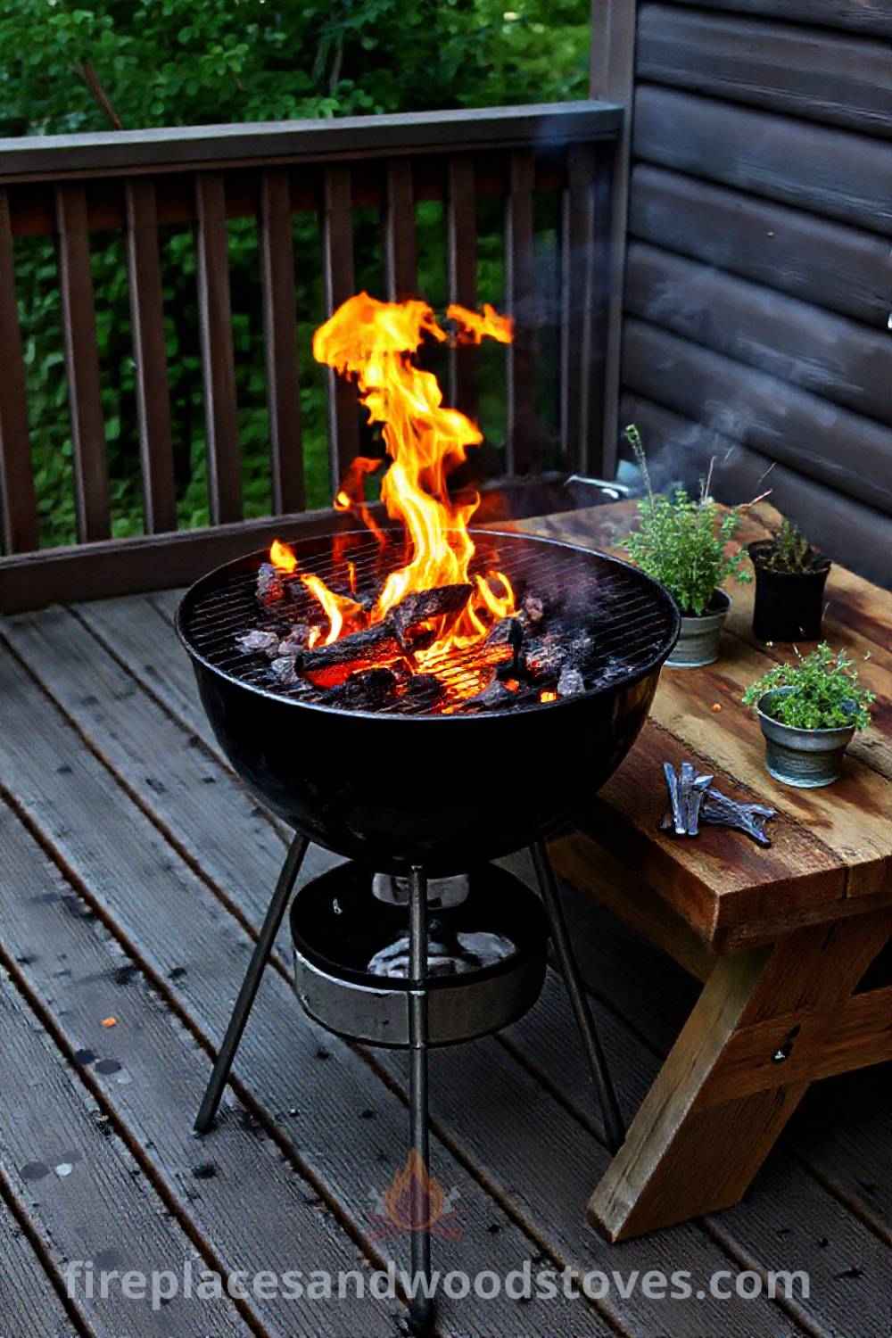 Charcoal grill barbecue on a weathered wooden deck with potted herbs and utensils, creating a cozy outdoor dining atmosphere perfect for gatherings and summer cookouts. Visit patioandhomefurniture.com for stylish ideas that will wow your guests.