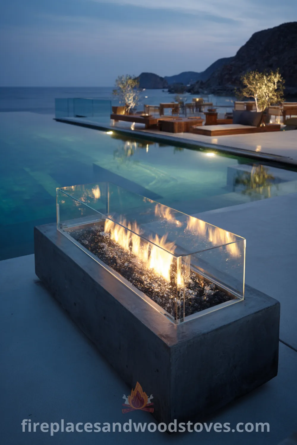 Modern minimalist outdoor fireplace by a shimmering pool with glass shield, tranquil outdoor space, and sleek design elements.