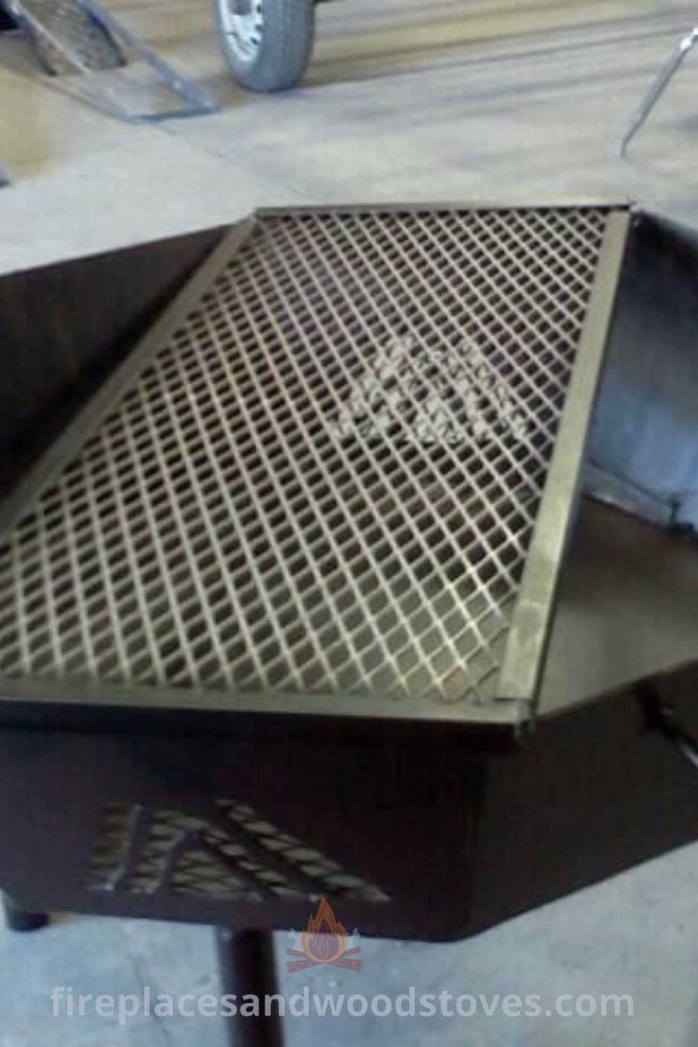 A large metal grill fire pit on a table, showcasing stylish designs that transform your outdoor space. Explore metal fire pits, octagon fire pits, and creative metal projects for your backyard. Get inspired by incredible ideas at patioandhomefurniture.com.