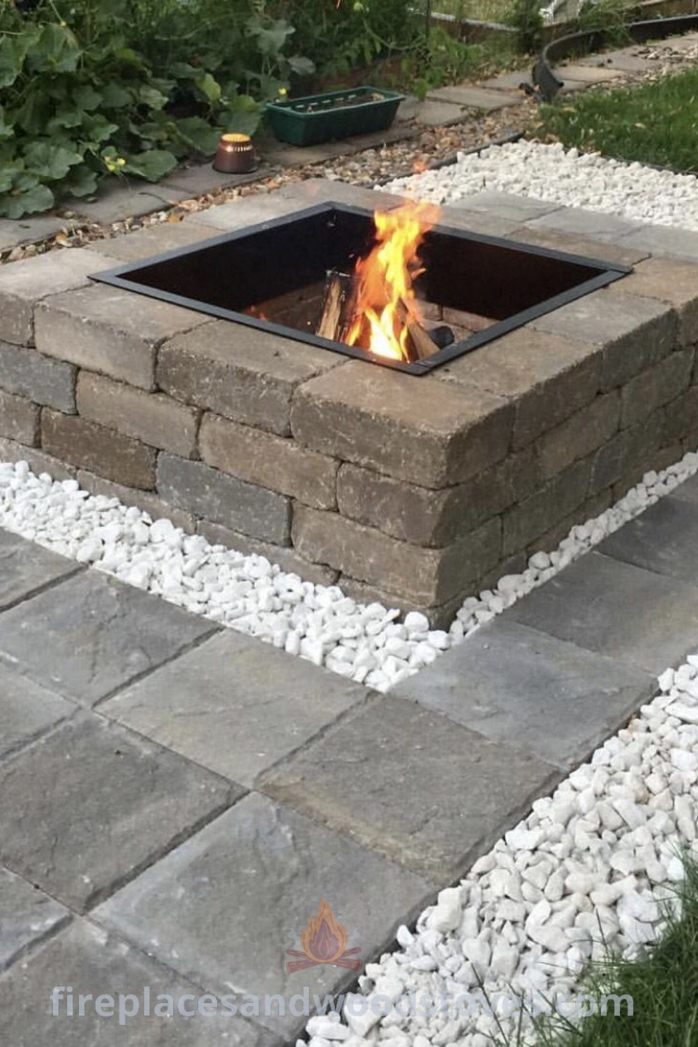 A paver fire pit on a stone walkway, creating a stylish outdoor fire pit area perfect for gathering and entertaining. Explore incredible ideas for transforming your backyard at patioandhomefurniture.com.