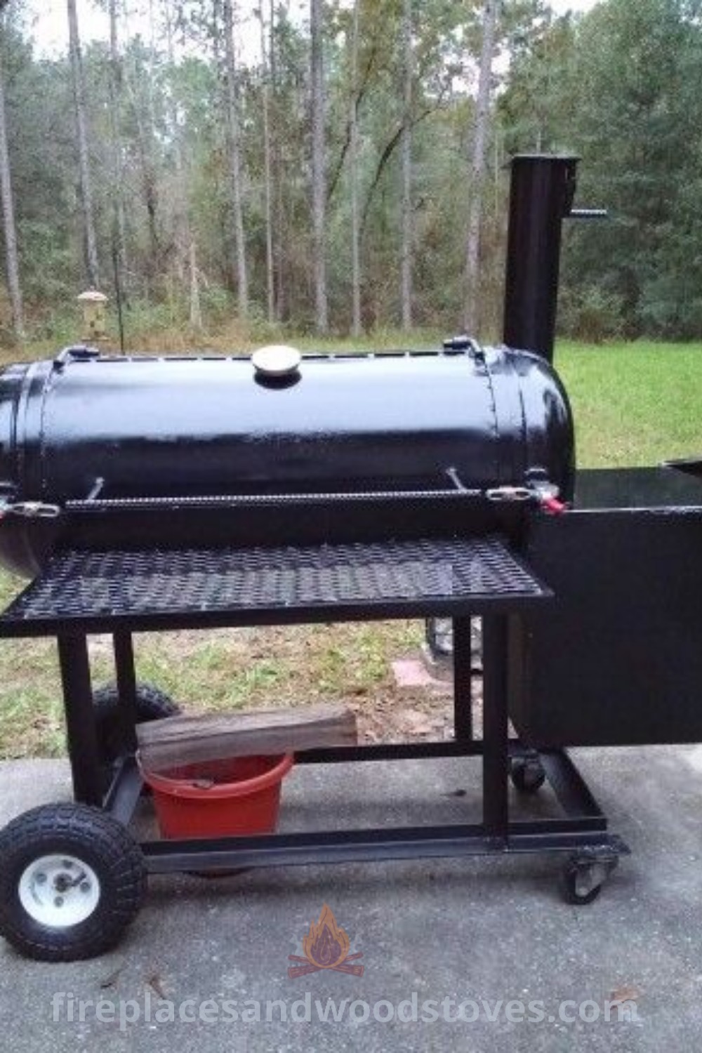 An outdoor bbq grill with wheels on the side, ideal for backyard smokers and DIY BBQ enthusiasts. Featuring a stylish design that enhances your outdoor space and offers incredible ideas for grilling, discover more inspiration at patioandhomefurniture.com.